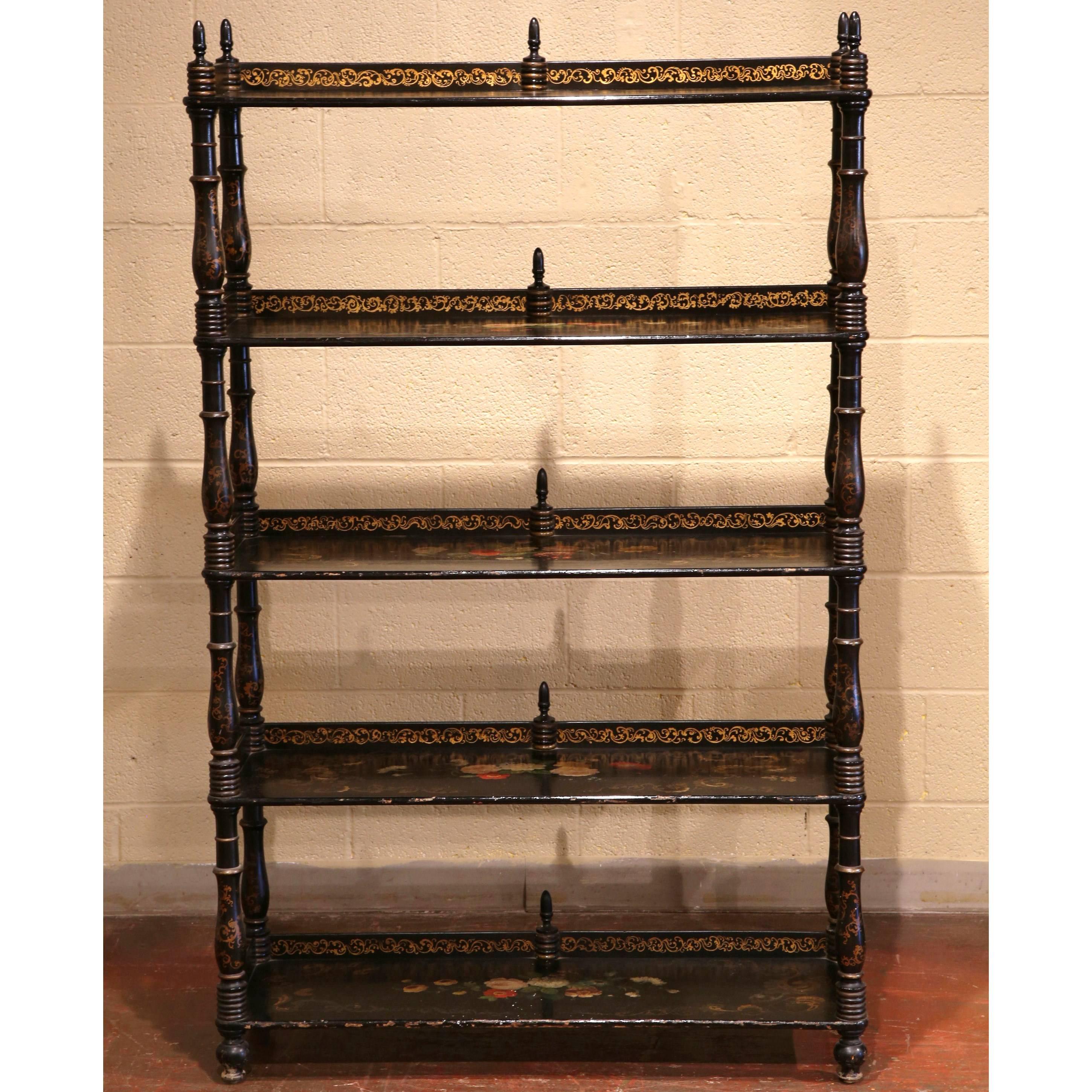 This elegant display cabinet was crafted in France, circa 1870. The antique shelving unit has five shelves, all of which are decorated with an original black lacquer paint finish, colorful flowers and gilt motifs. The display piece is in excellent