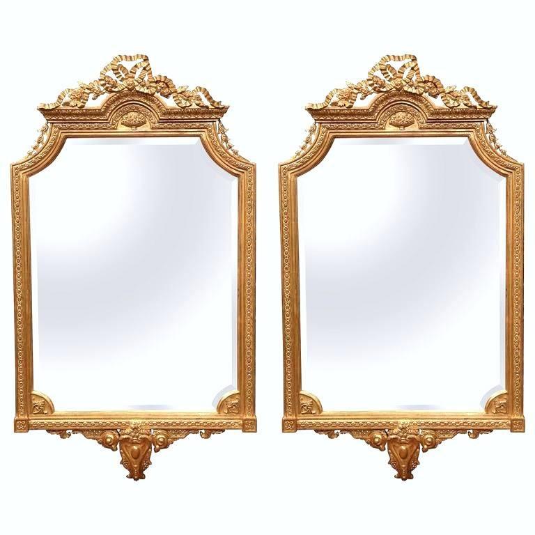 Pair of Mid-20th Century Louis XVI Carved Giltwood Mirrors with Bevelled Glass