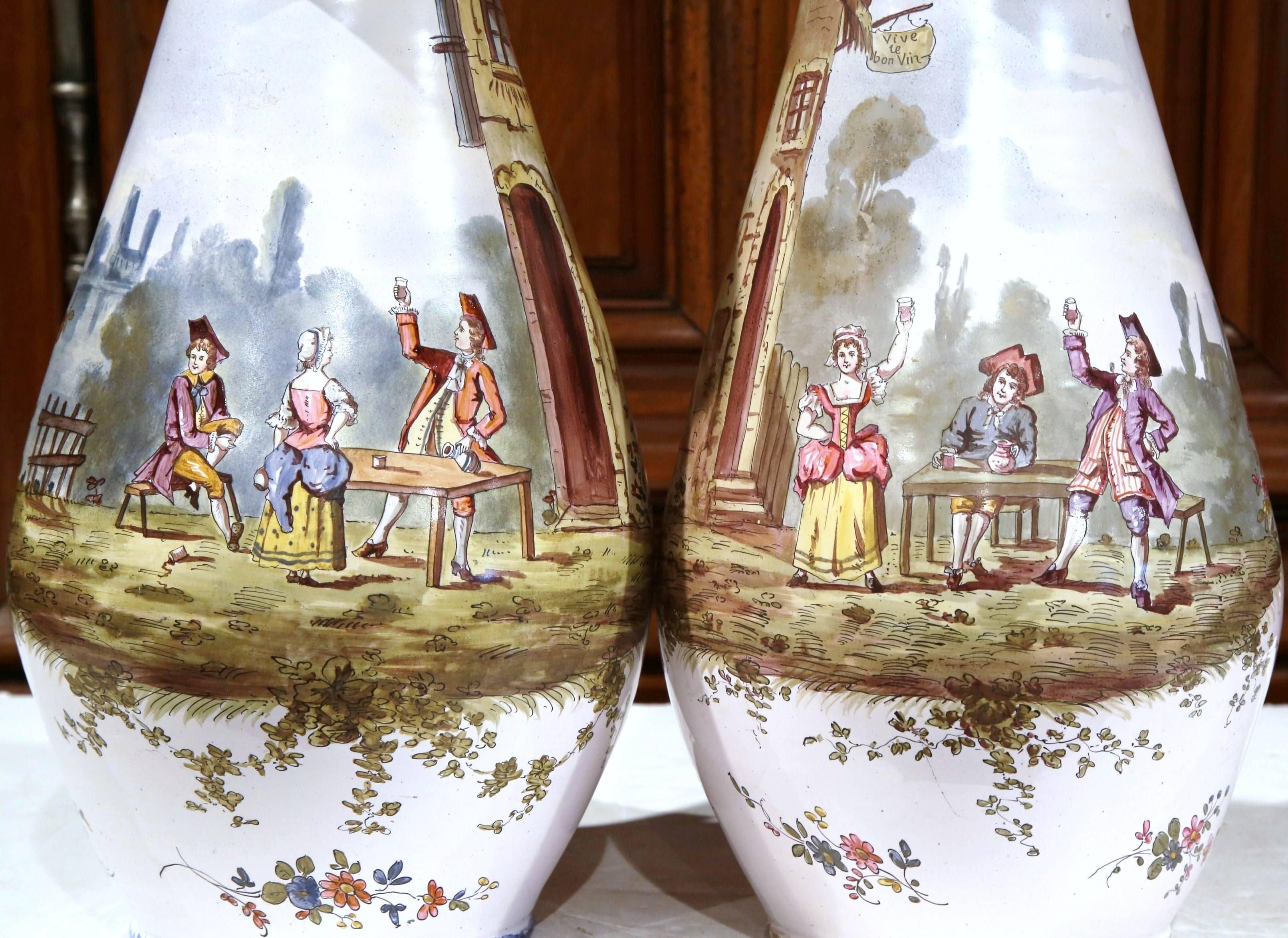 Hand-Crafted Pair of 19th Century, French, Painted Faience Wine Pitchers with Tavern Scenes