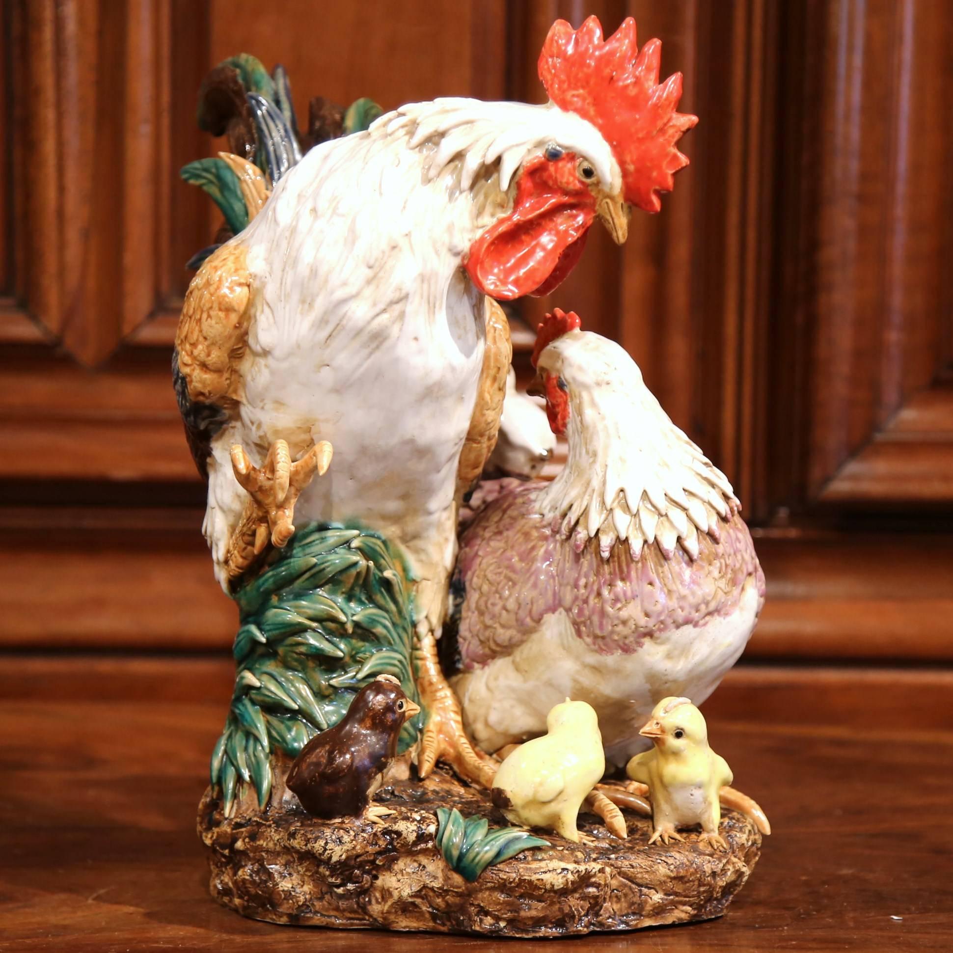 For a true country French look, place this Majolica chicken sculpture on your kitchen counter or on a shelf. Handcrafted in France, this hand-painted ceramic features a proud rooster with his hen and four little chicks at their feet, including one