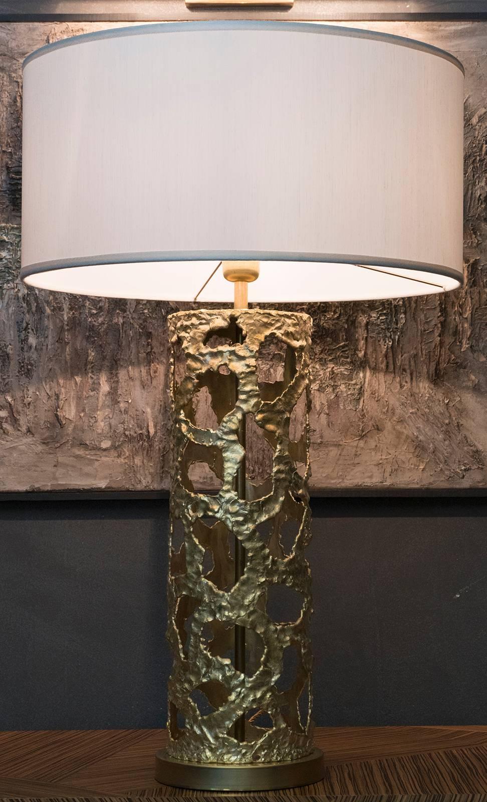 Table lamp  crafted by local artisans in natural brass without a lacquer finish., this gives the piece a vintage patina that is the main characteristic of the Flair edition, 
structure cm19 x H 60, white shantung lampshade cm50 x H 24, total high