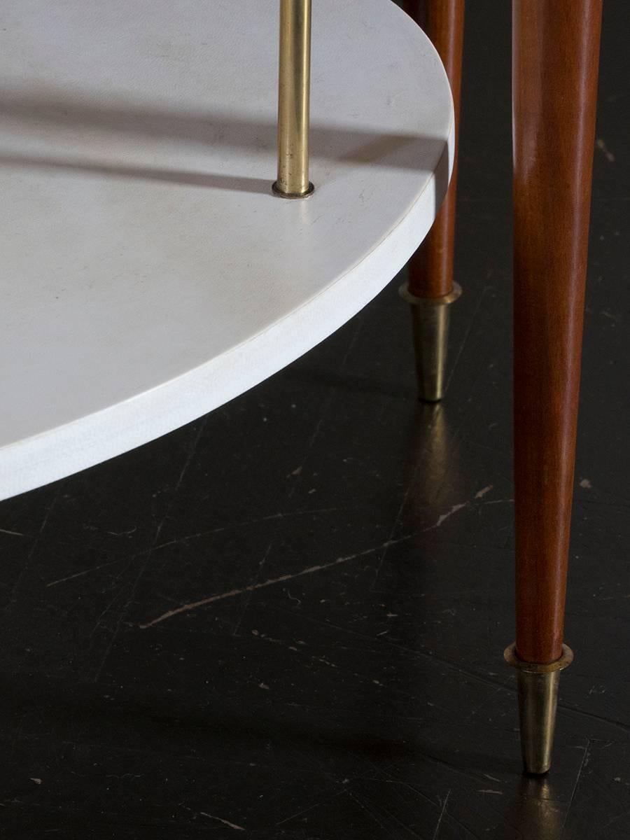 Walnut structure and goat skin top, brass details.