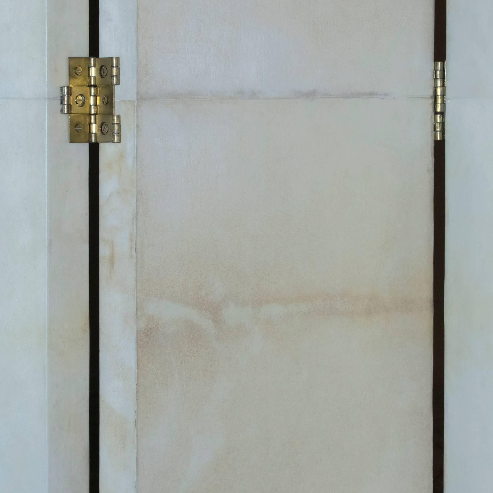 21st century four panels screen covered in Parchment, brass hardware, out of production piece so one of a kind, we have two screens available, one with both side in beige color, another one with one side in beige and the other side in light grey as