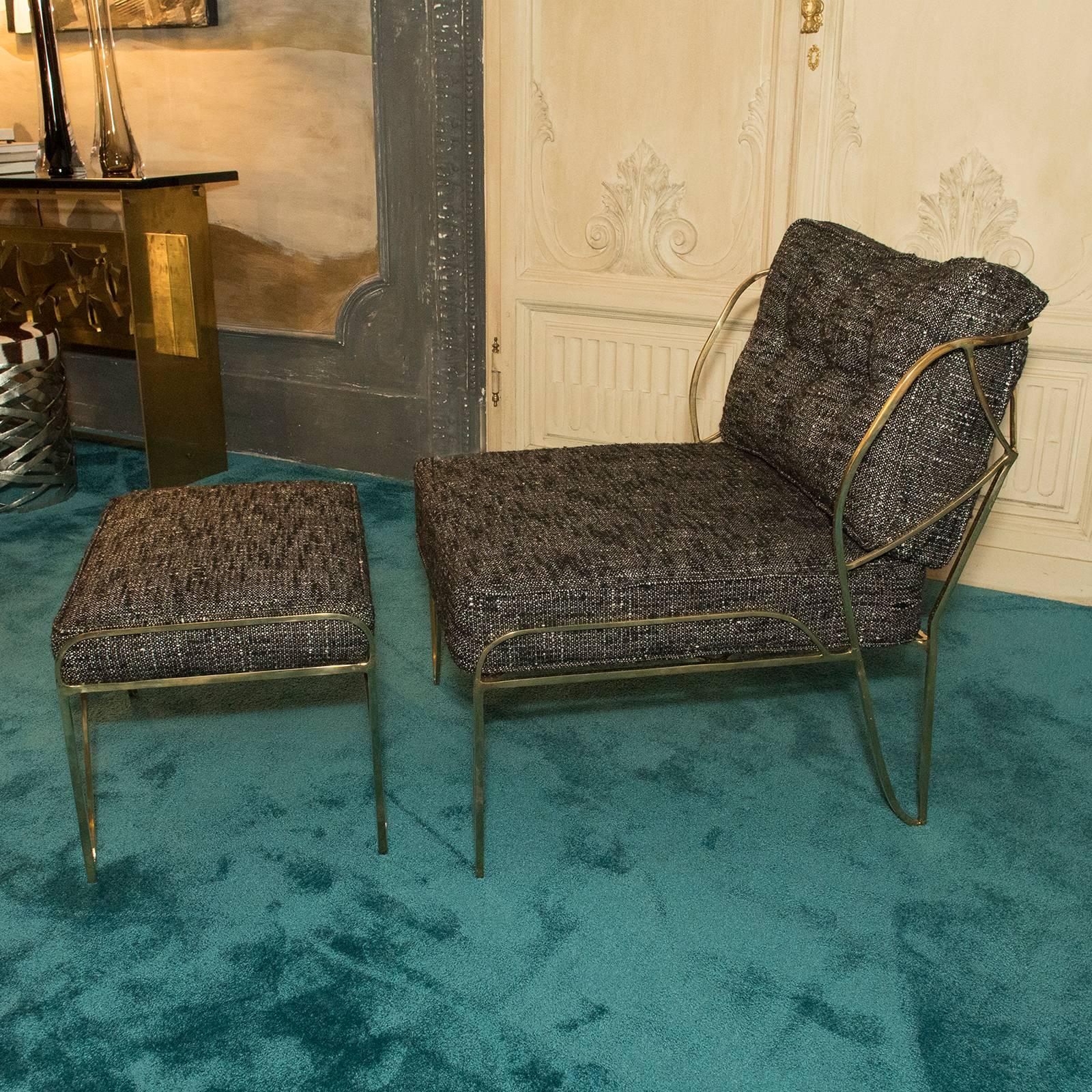 Sculptural gilded bronze structure, upholstery in brown/black fabric, ottoman size cm 60 x 42 x H.38.