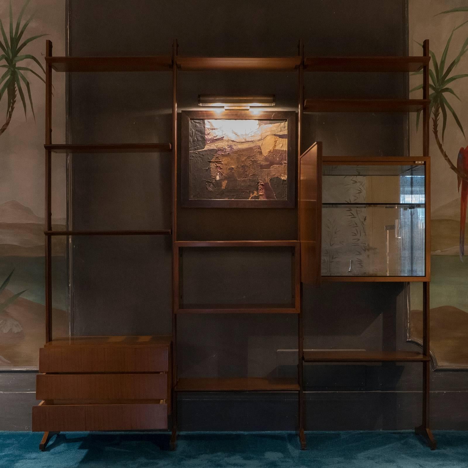 Italian freestanding wall unit or bookcase with adjustable nine shelves, three drawers, one box section and one storage section or dry bar with mirrored interior and a smoked glass shelve, black steel details, each component is finished both front