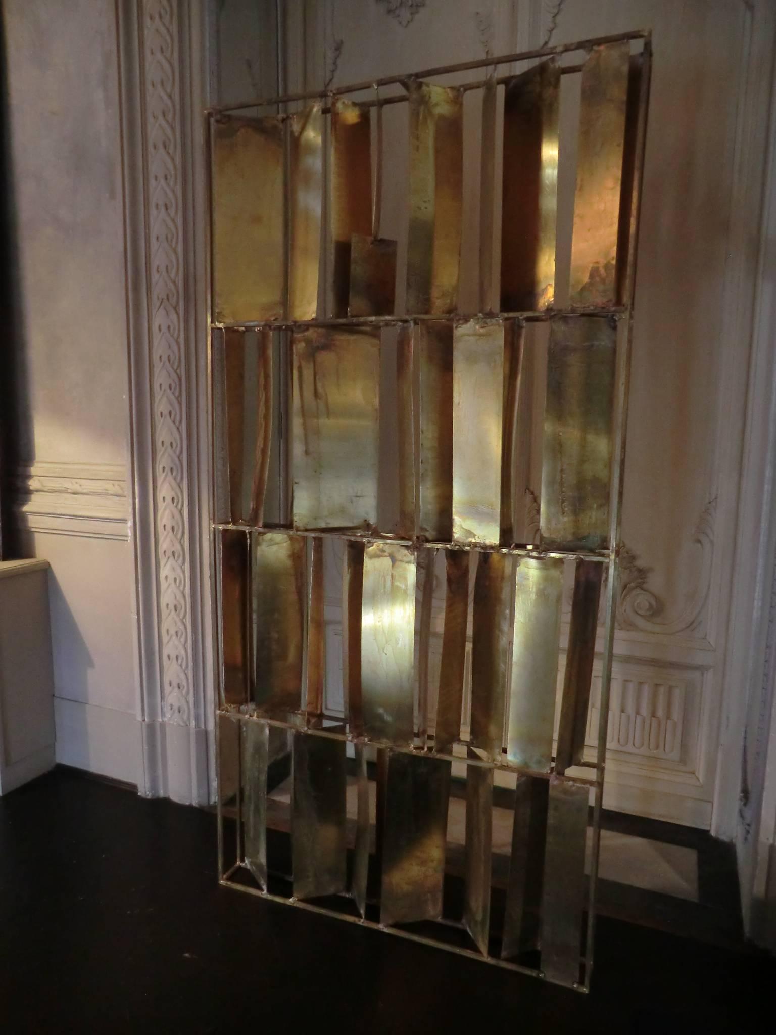Natural brass screen Brutalist style, every piece is unique and with peculiarities and slight differences, completely handmade by local artisans.