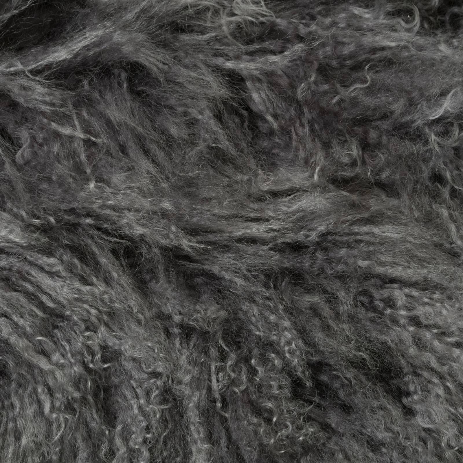 Grey Mongolia fur pillows with black wool backing.\
 