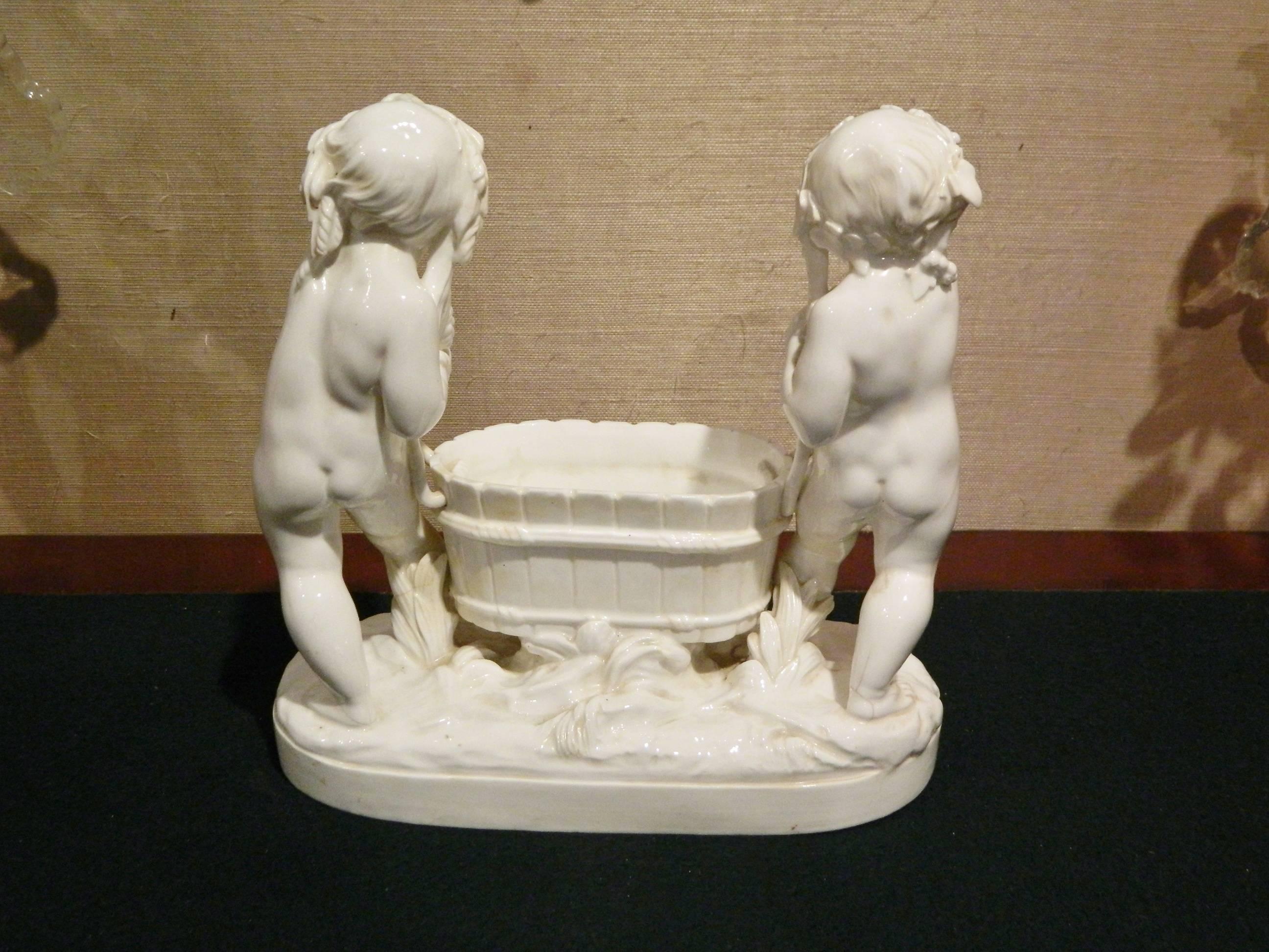 German Porcelain Figural Jardiniere Depicting Putti, 19th-20th Century In Excellent Condition In Savannah, GA