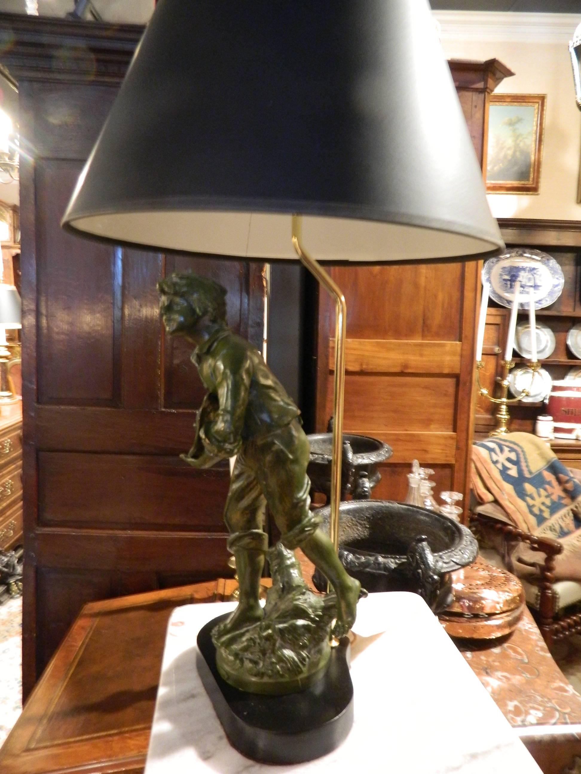 19th century Par Francois Moreau bronze figural adapted as a lamp on a wood base. Label reads Denicheur, Par Francois Moreau.
    