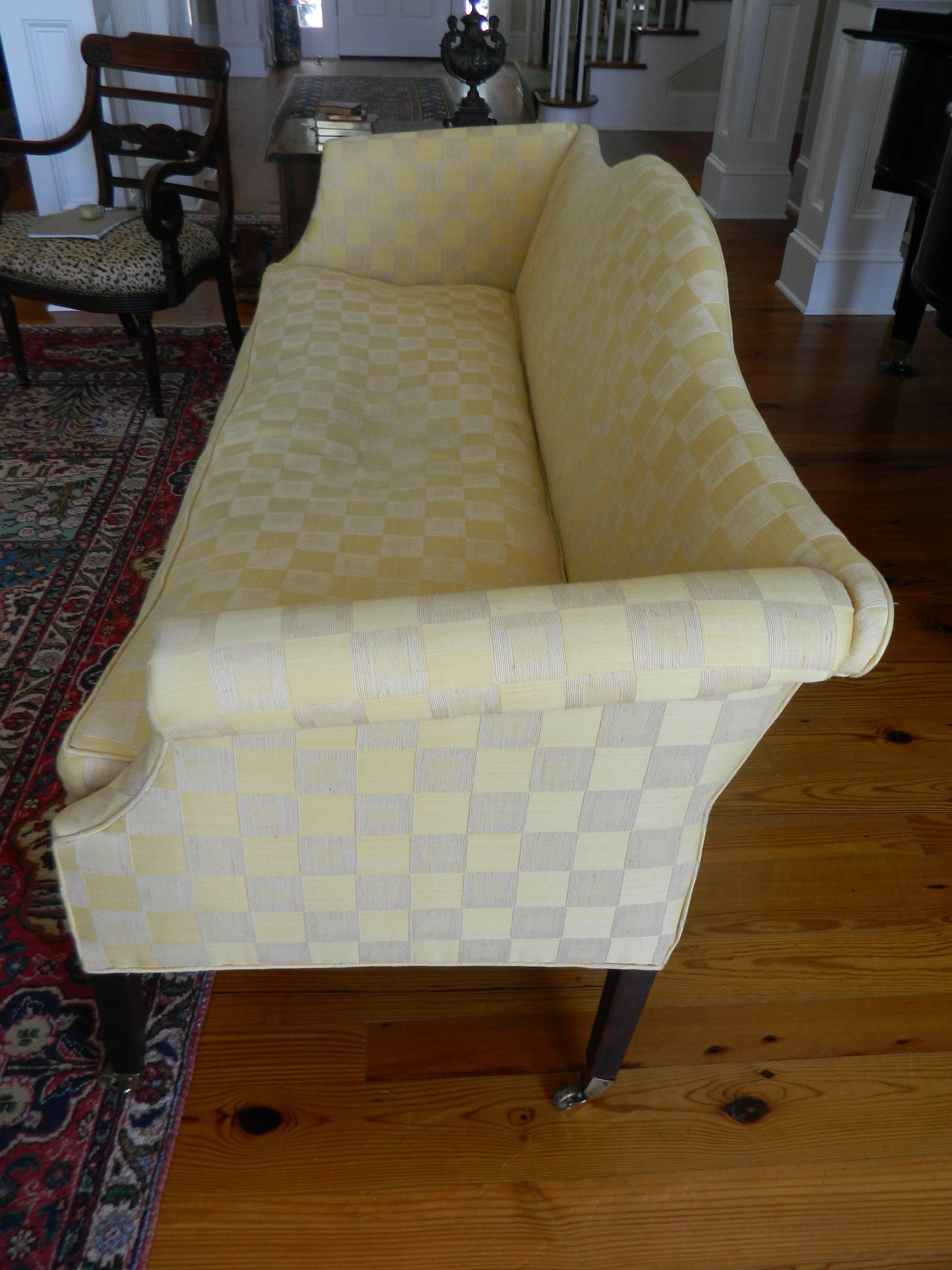 American fine Chippendale federal style upholstered sofa, circa 1780. Down seat cushion. Mahogany frame with serpentine front rail and scrolled arms, arched back.
 