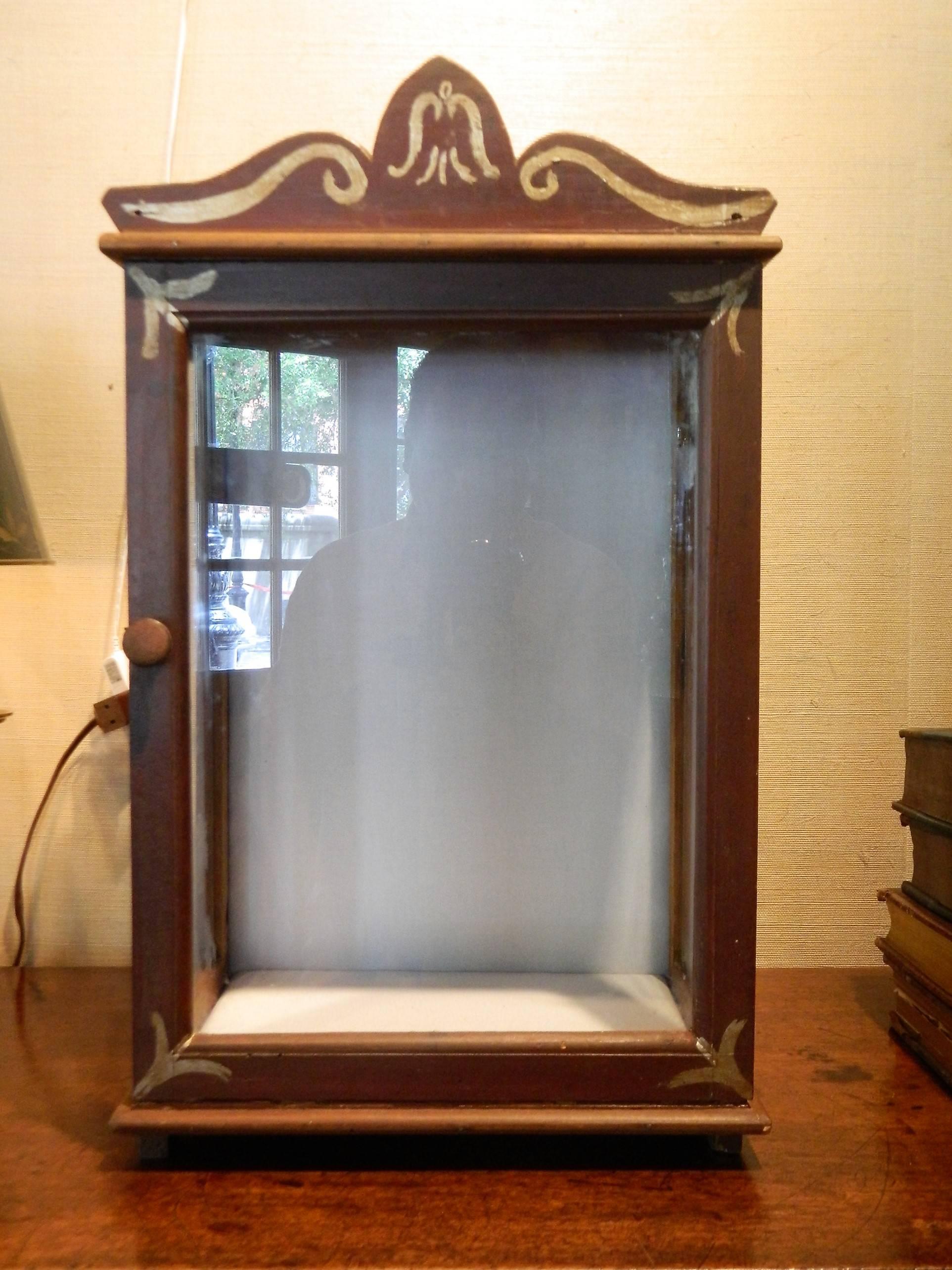 Late 19th-early 20th century painted display vitrine or niche cabinet. Interior has been upholstered in an off-white fabric.
      