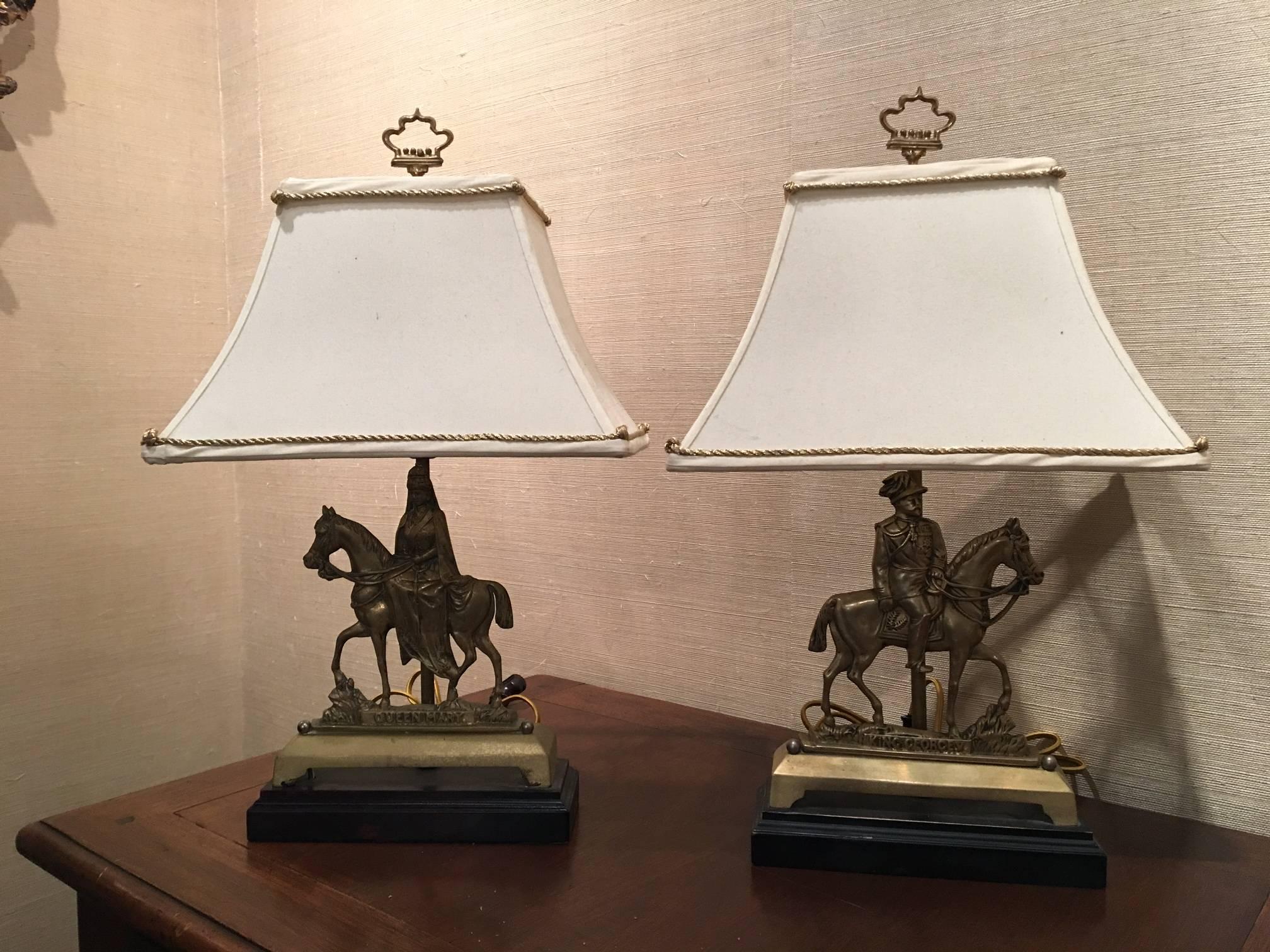 Pair of brass Chenets adapted as table lamps on wood bases, 19th century. One reads 