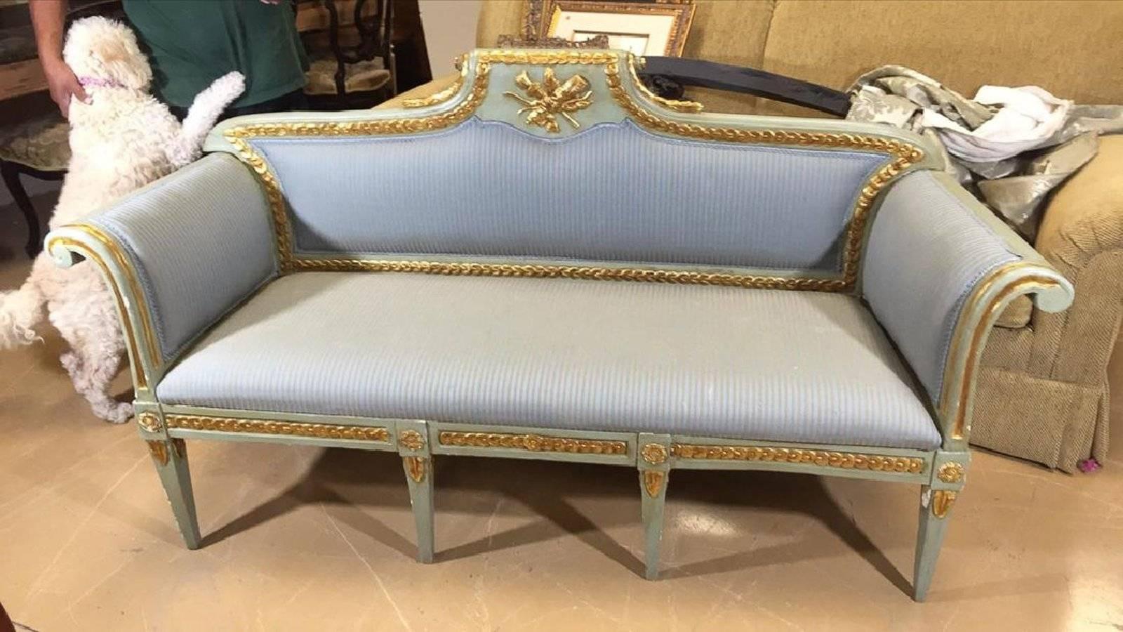 Italian painted sofa from Venice, with symbol of love carving, gold gilt highlights, 18th century.
  
