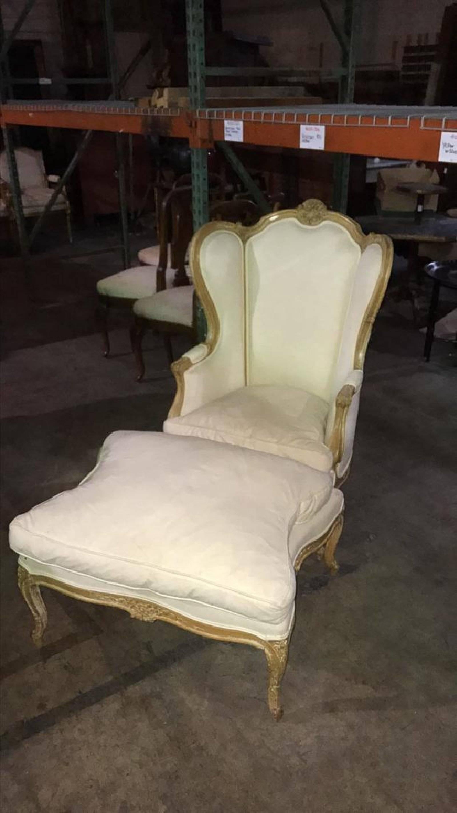 French Louis XVI style carved bleached walnut bergere with ottoman, 19th century.  New upholstery needed or you can recover it over the muslin 
