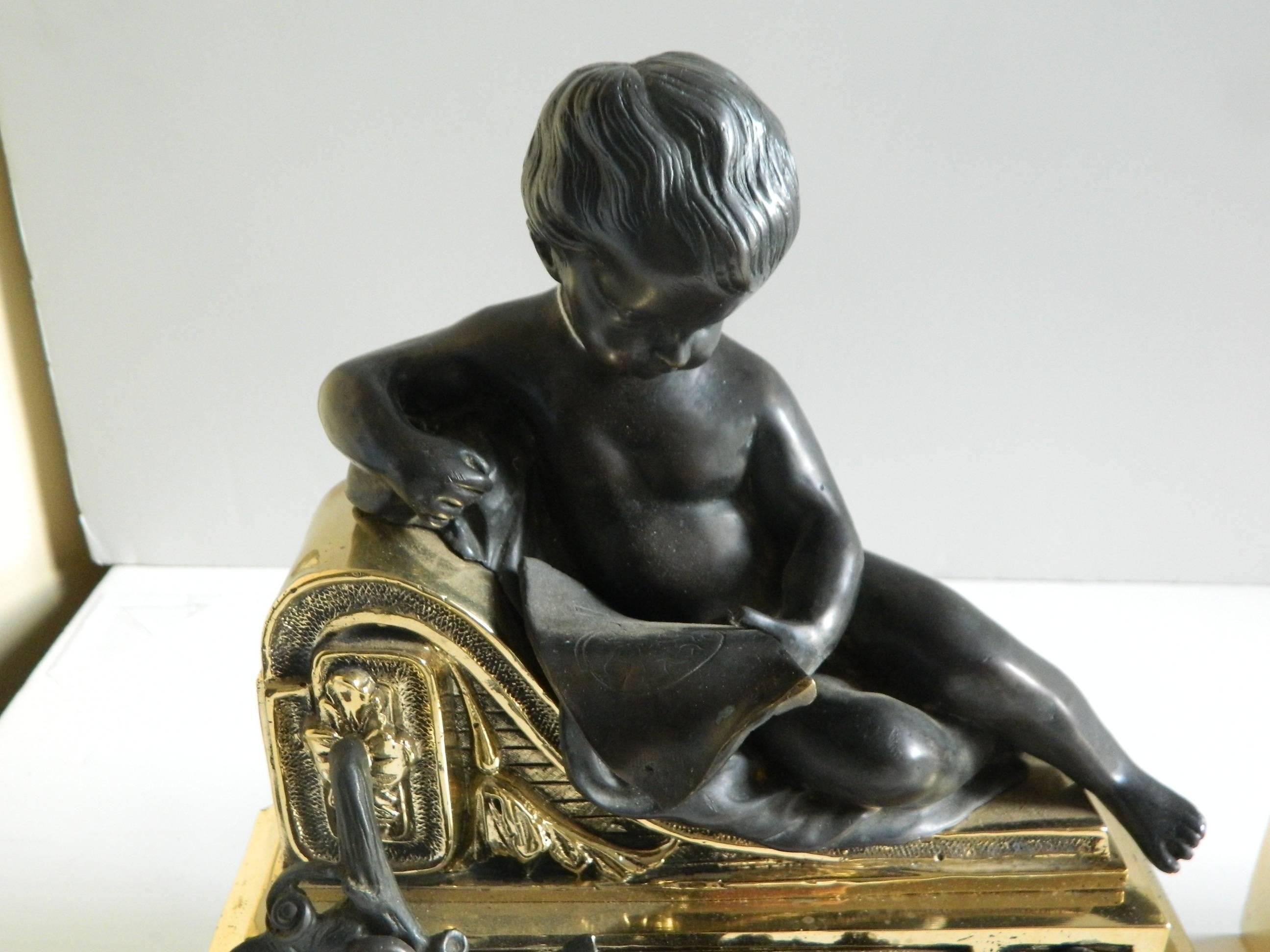 French Pair of Polished Brass Chenets or Andirons with Bronze Cherubs, 19th Century For Sale