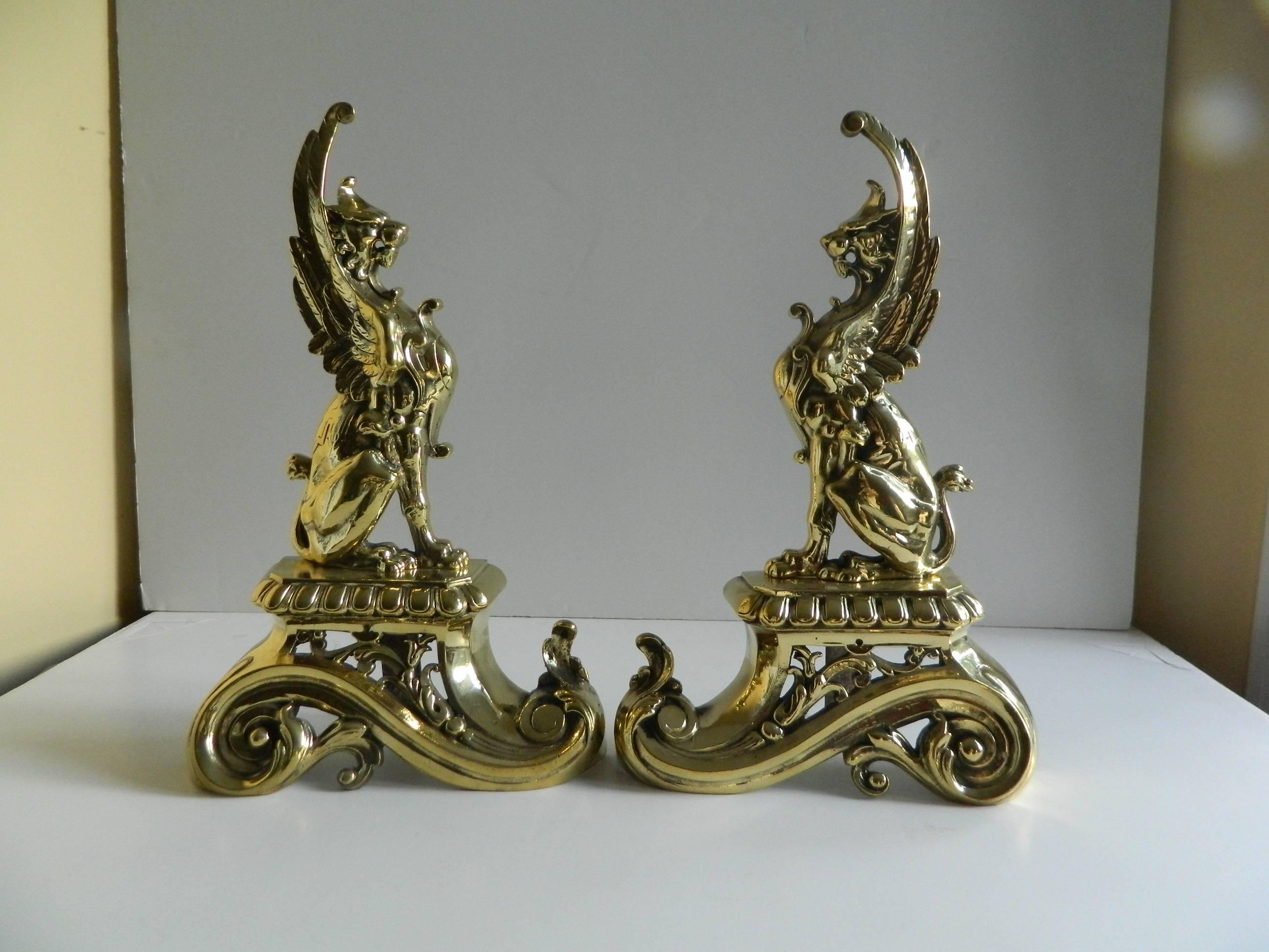 Pair of brass chenets or andirons, sphinx motif, 19th century.
 