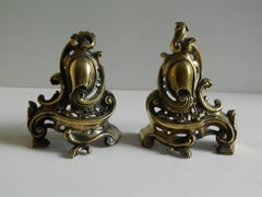 Pair of Brass Small Chenets or Andirons with Shield and Scrolls, 19th Century