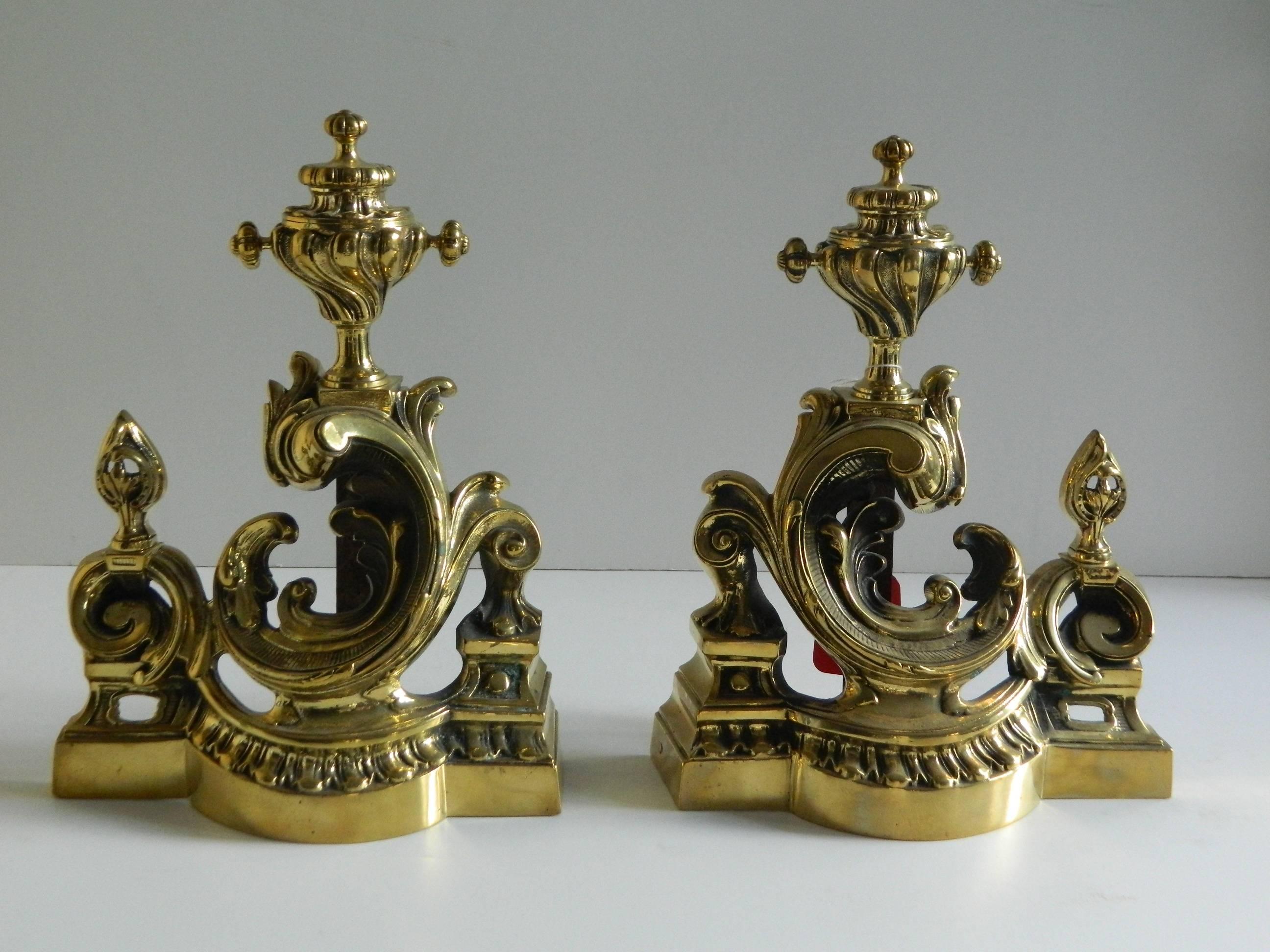 Pair of polished brass chenets or andirons - scroll motif, 19th century.
      