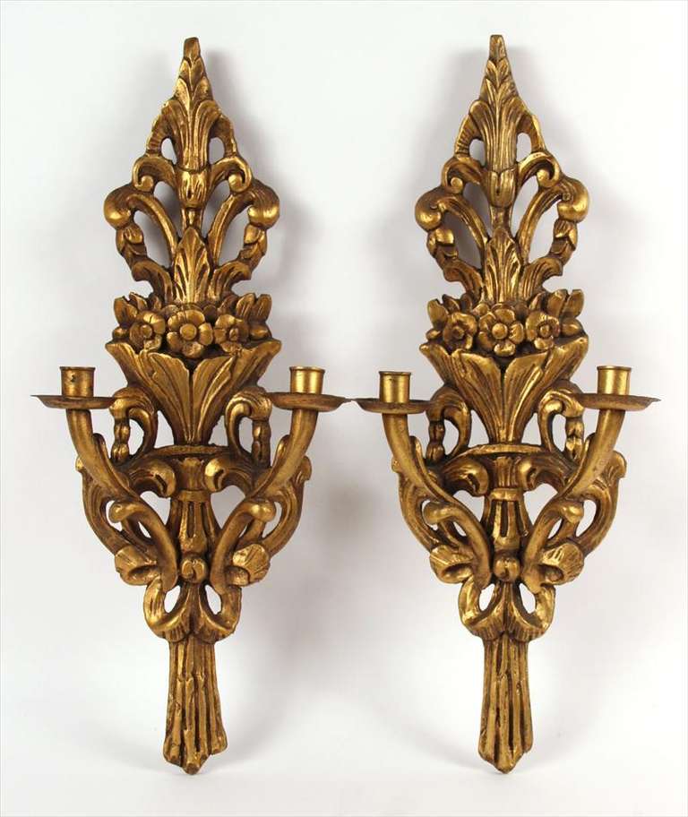 Early 20th century pair of Italian giltwood two-arm wall sconces. Currently they are not wired, but can be wired at no additional cost.