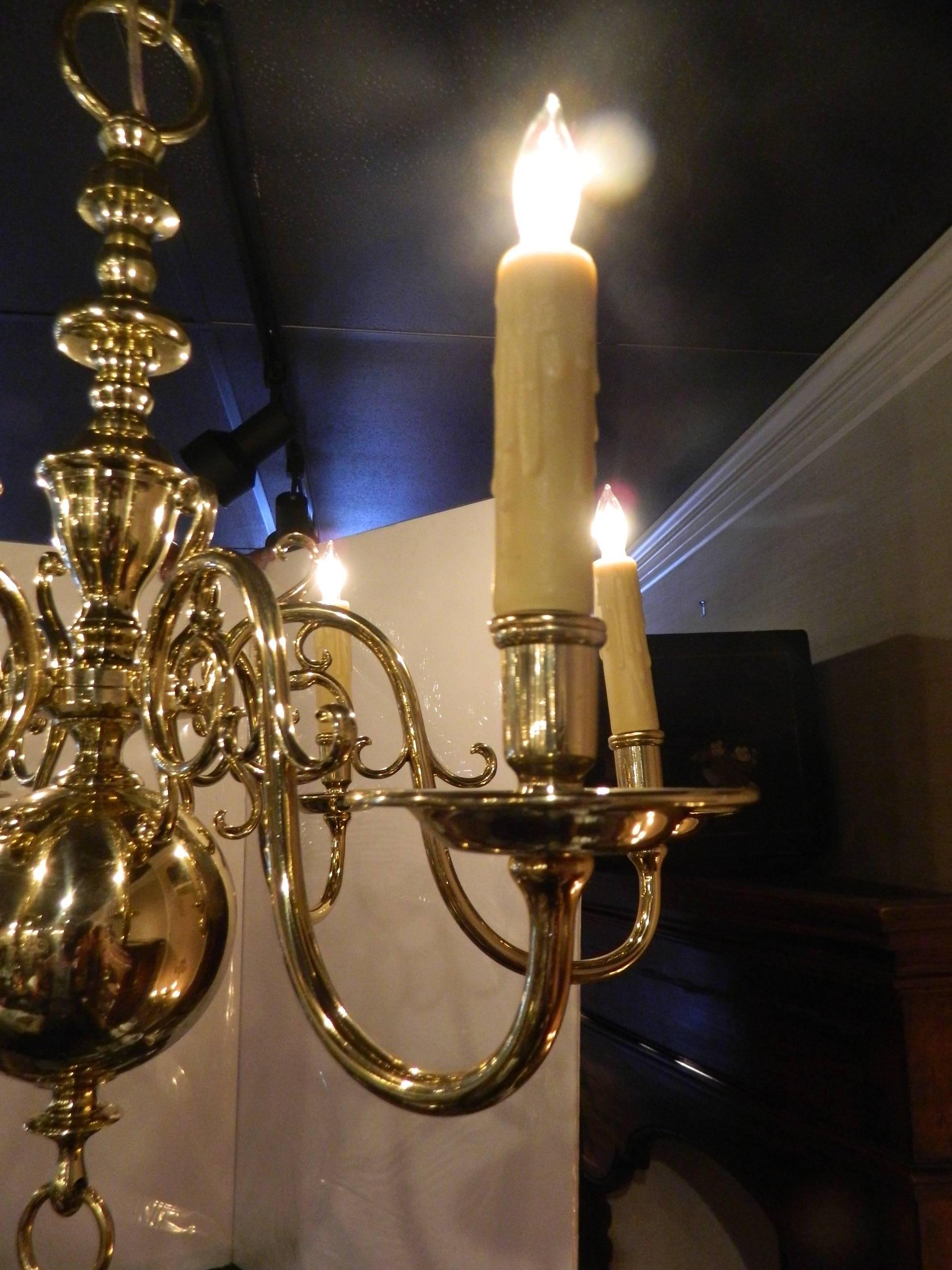 Dutch style polished brass six light chandelier, 19th century. US wired. Poly wax sleeves.