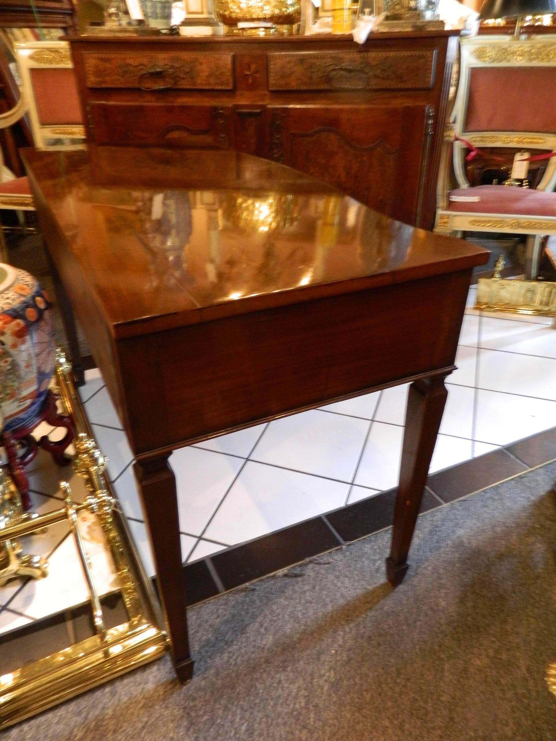 19th century French mahogany desk or Buffet with two pull-out drawers on spaded feet.  Distance from the floor to the bottom of the apron is 23