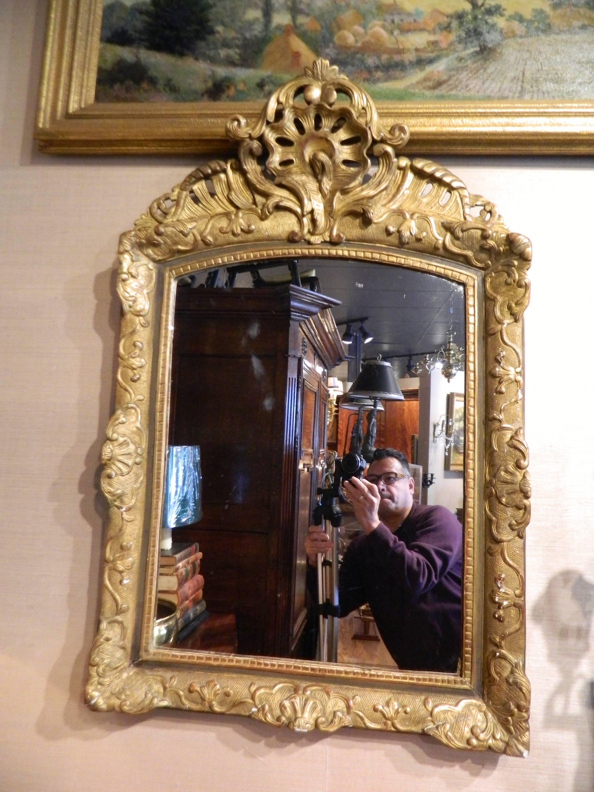 18th Century and Earlier Italian Gilt Gesso Mirror Adorned with a Rocaille Crest, 18th Century For Sale