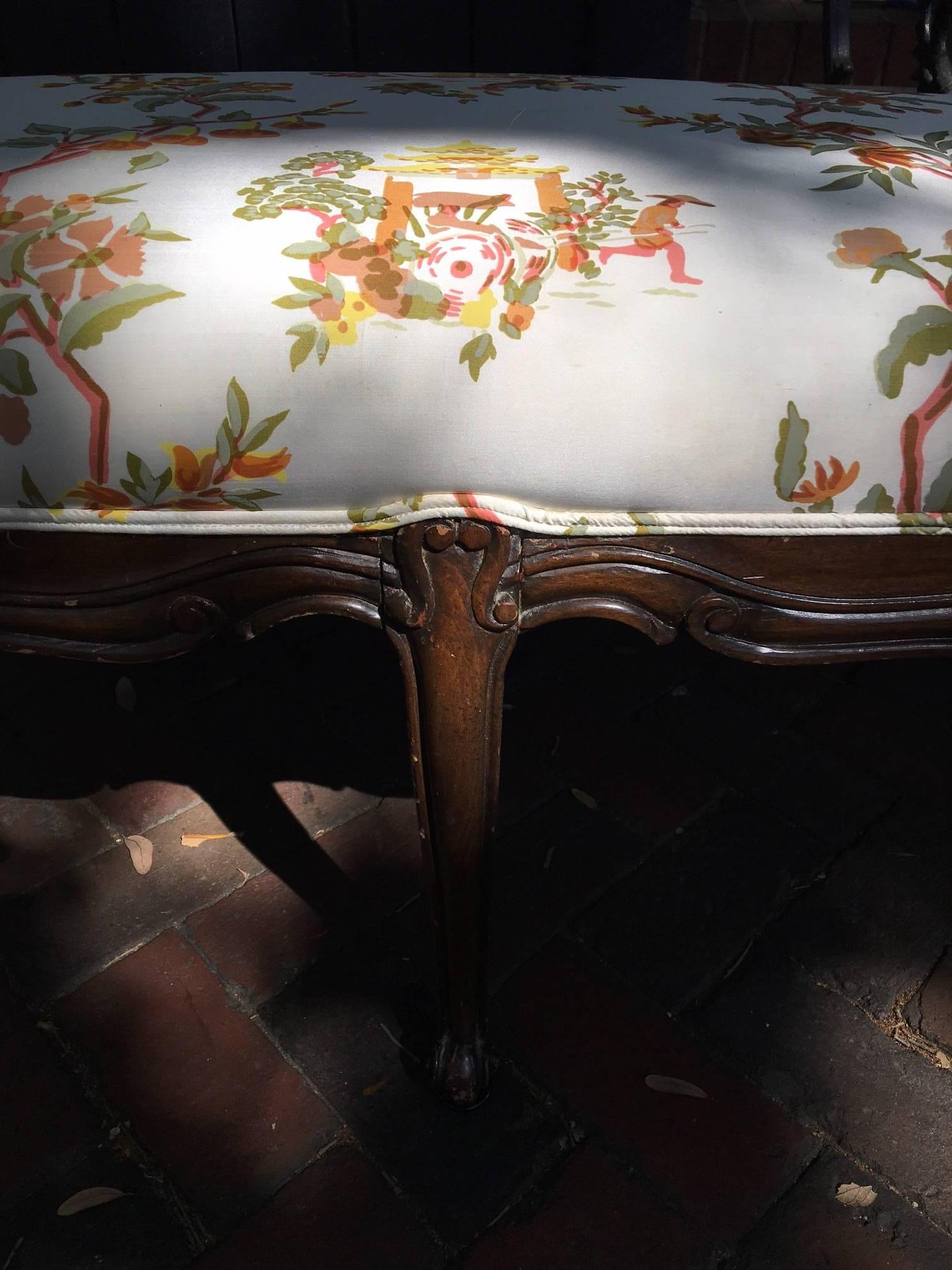 Louis XV style carved mahogany six leg bench, early 20th century. Having an upholstered seat.
 