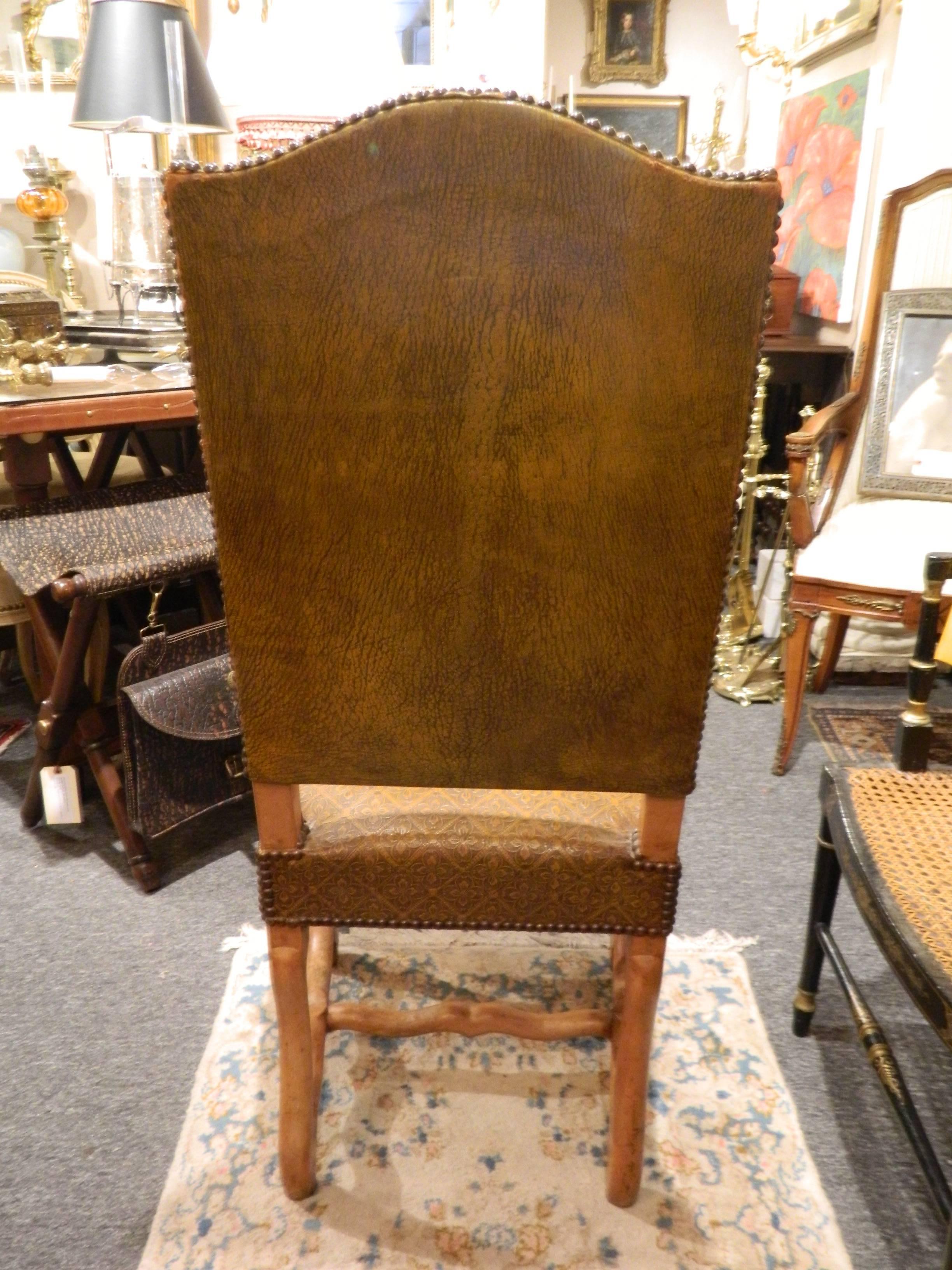 Pair of French side chairs upholstered in embossed leather with nailhead treatment, late 19th century.
  