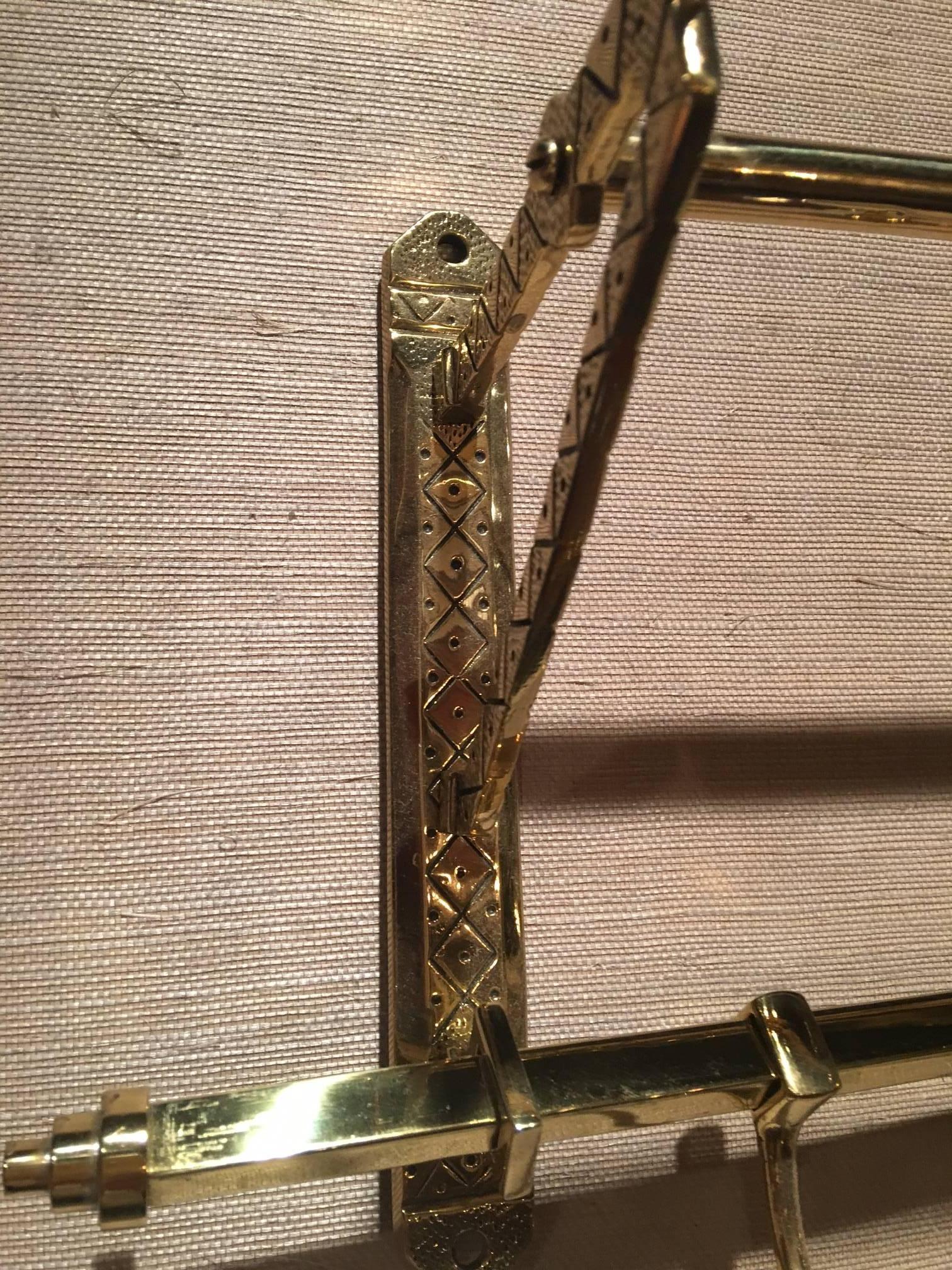 French solid brass coat rack and wall shelf, 19th century.
 