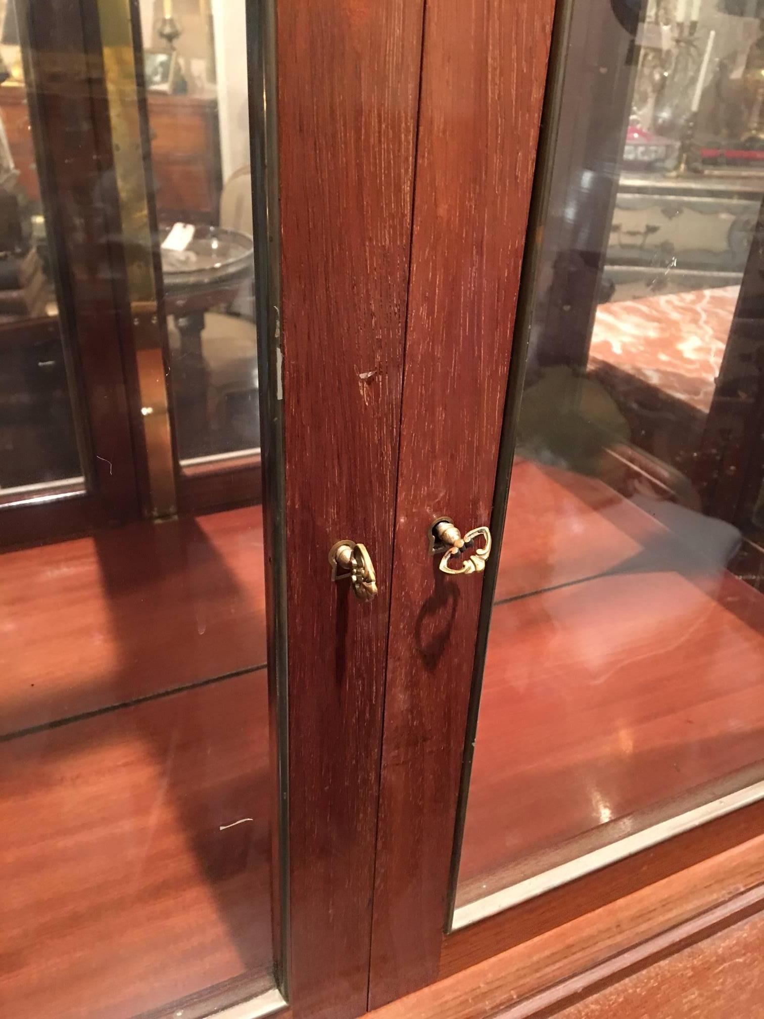 mahogany cabinet with glass doors