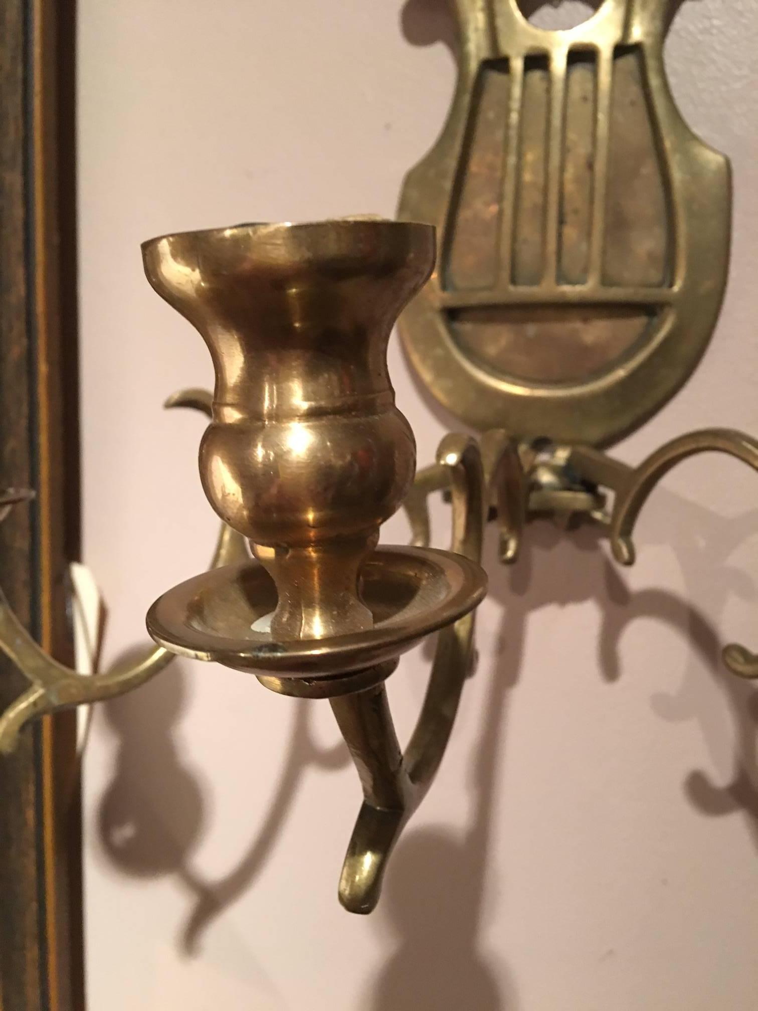 Pair of brass French three candle sconces, 19th century.