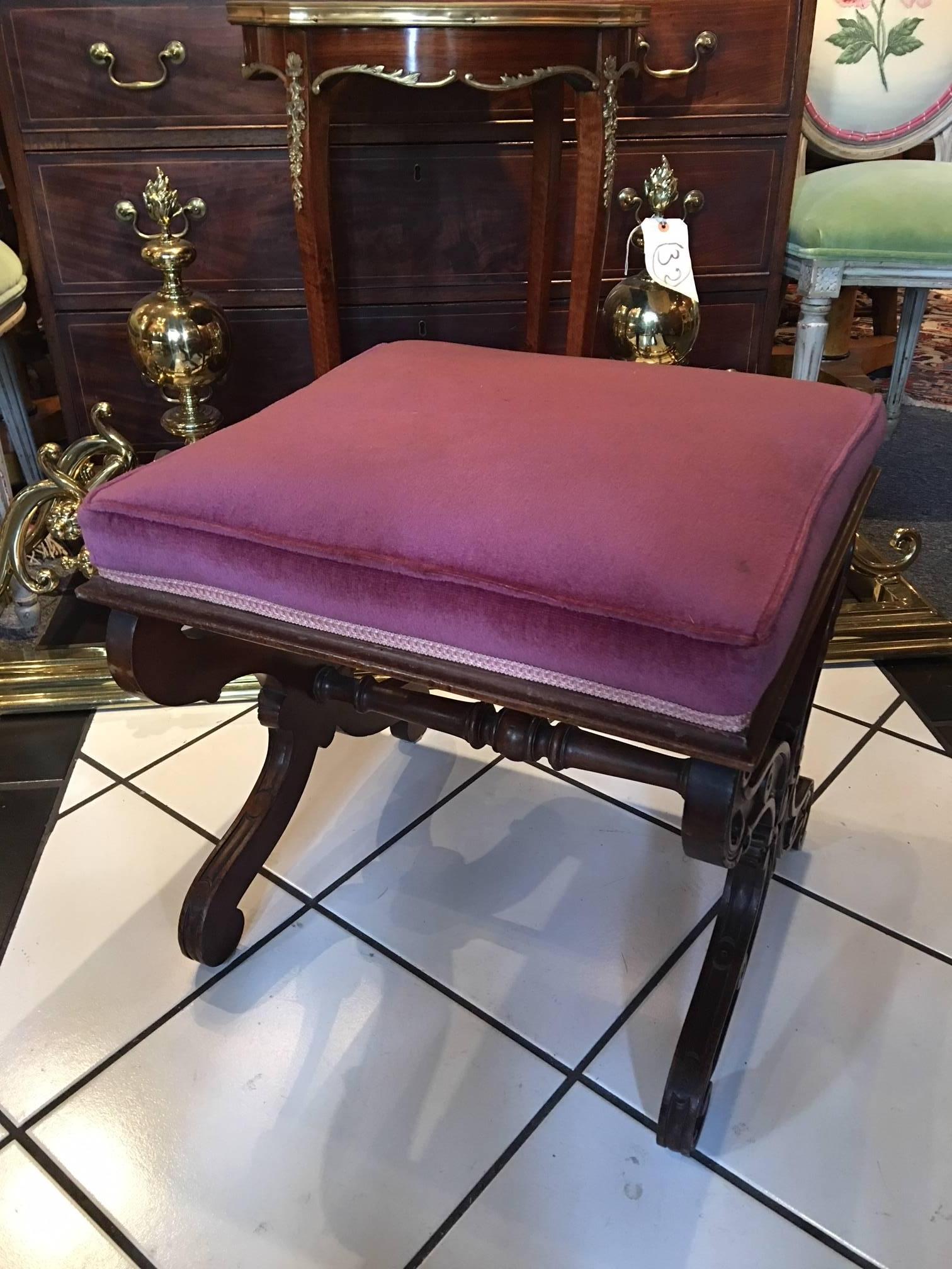 Louis Philippe carved walnut Curule bench, 19th century, square molded frame fitted with boxed cushion, foliate X-form legs, scroll feet.
 