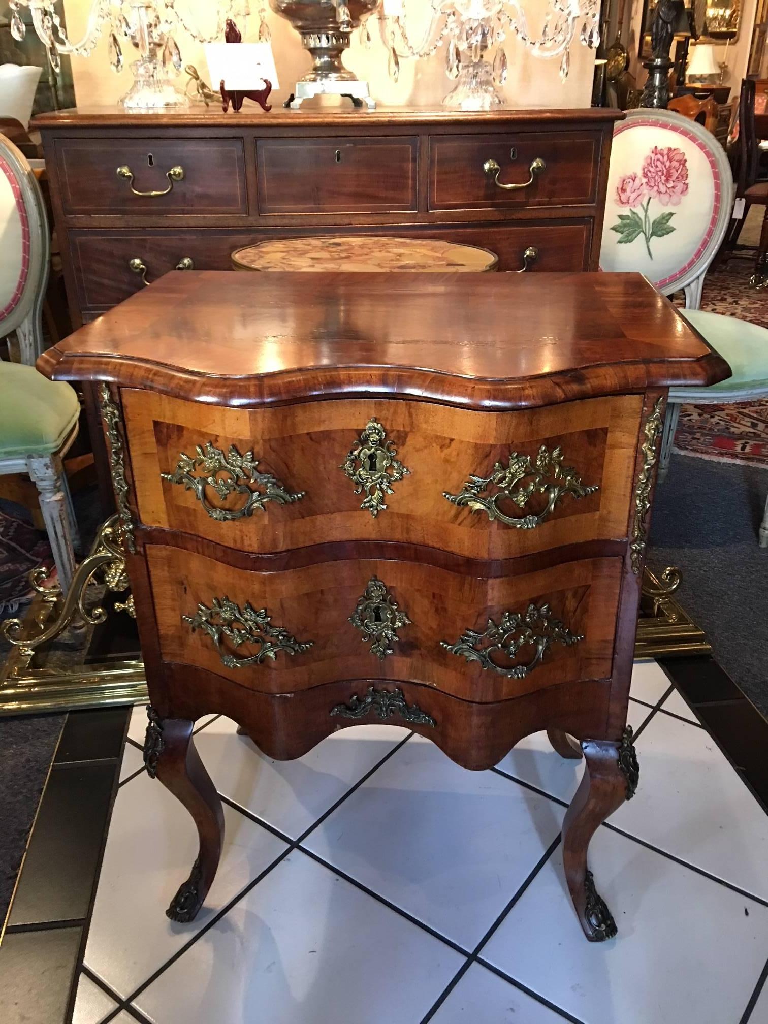 Continental figured walnut and gilt metal-mounted petite commode, 19th century, lockplates stamped 