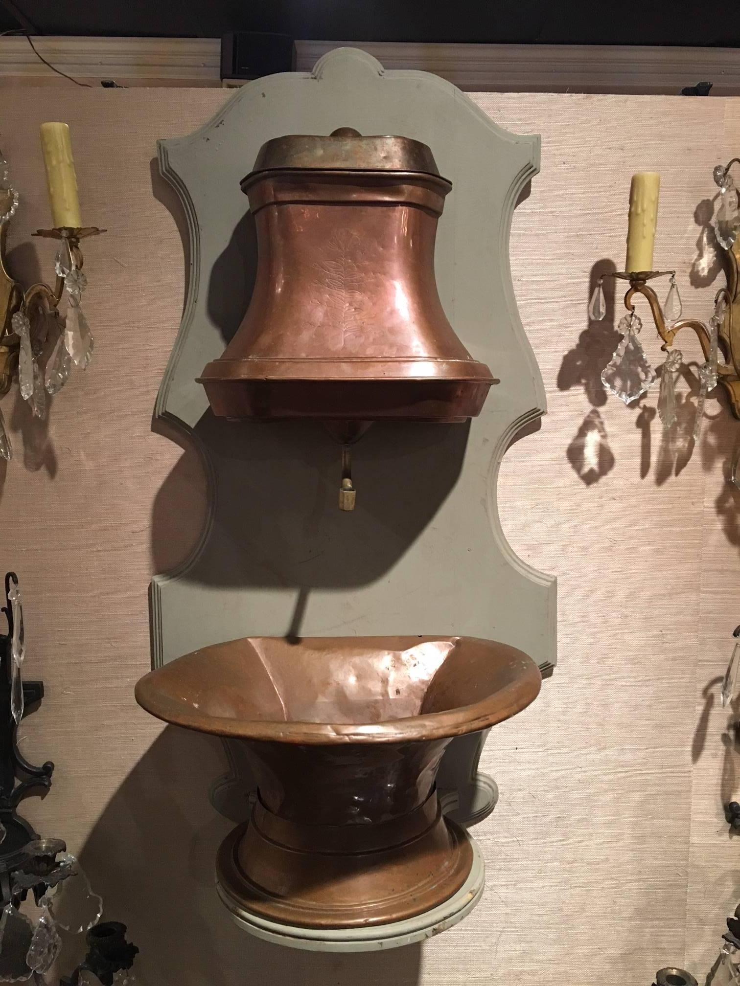 18th century French copper lavabo with brass accents on later board.
 