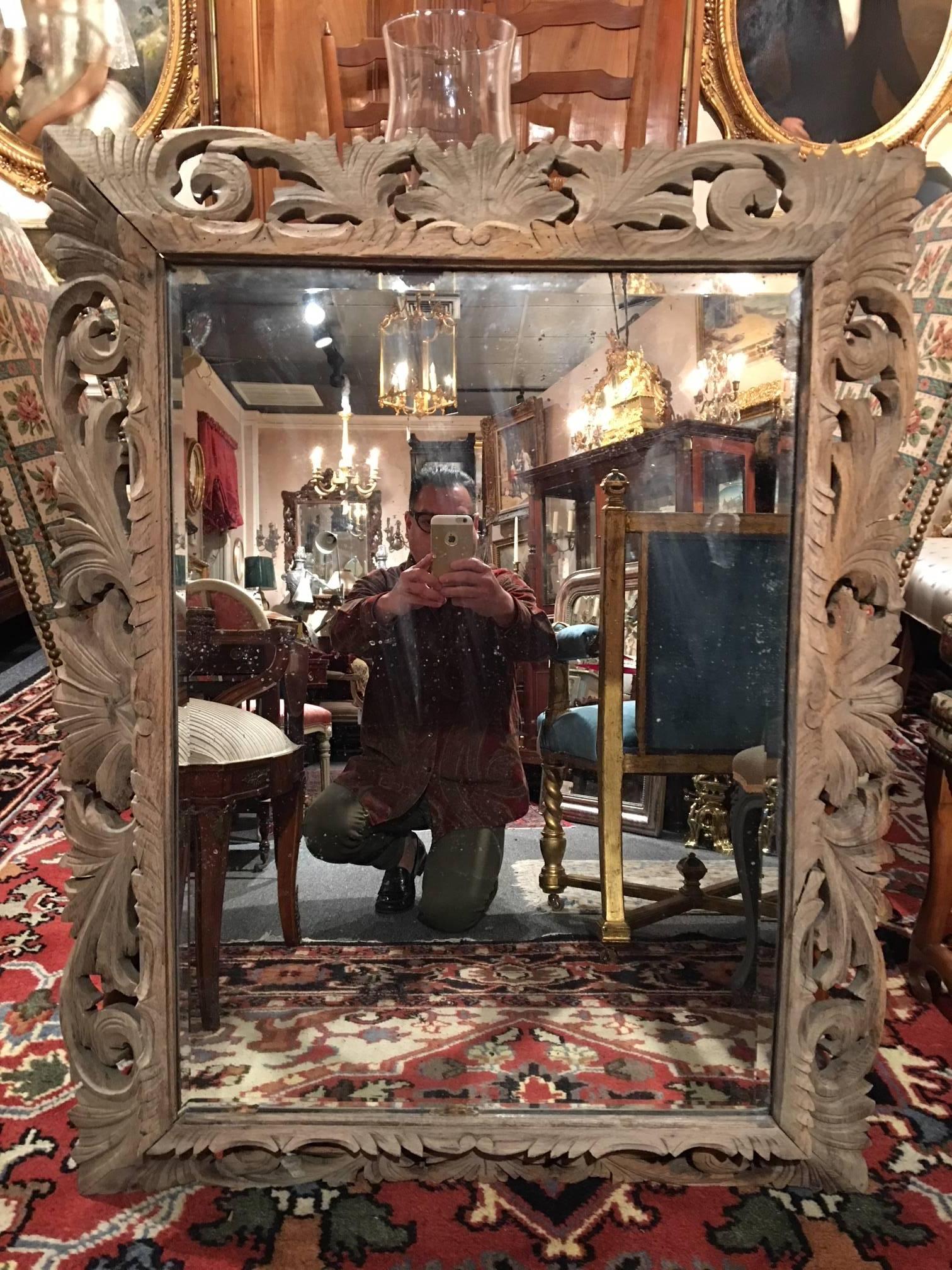 19th century Bleached French carved wood beveled mirror 