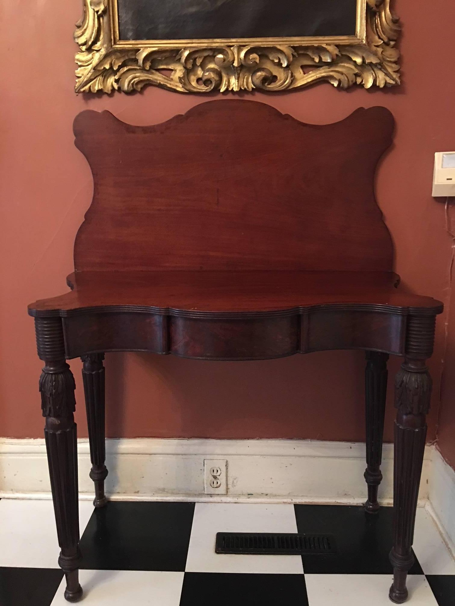 American games table with acanthus leaves decoration and tapered reeded legs, circa 1810. Massachusetts.