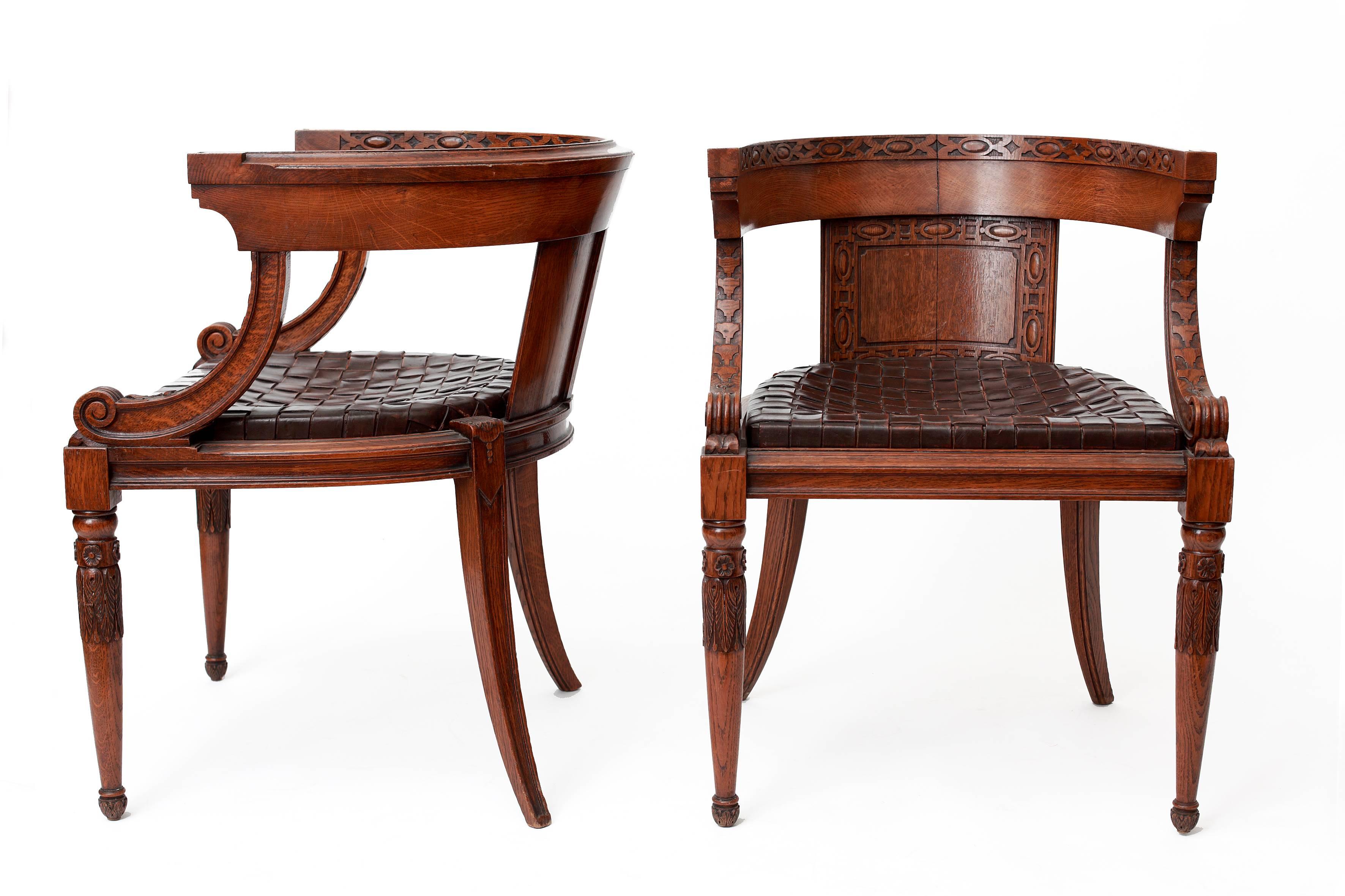 Pair of oak garden chairs decorated with designs inspired by the spirit of classic Antiquity such as acanthus leaves, Greek geometric and linear patterns. The seat consists of the original interlaced leather straps.
H. 75 cm, seat H. 47,50 cm, W.