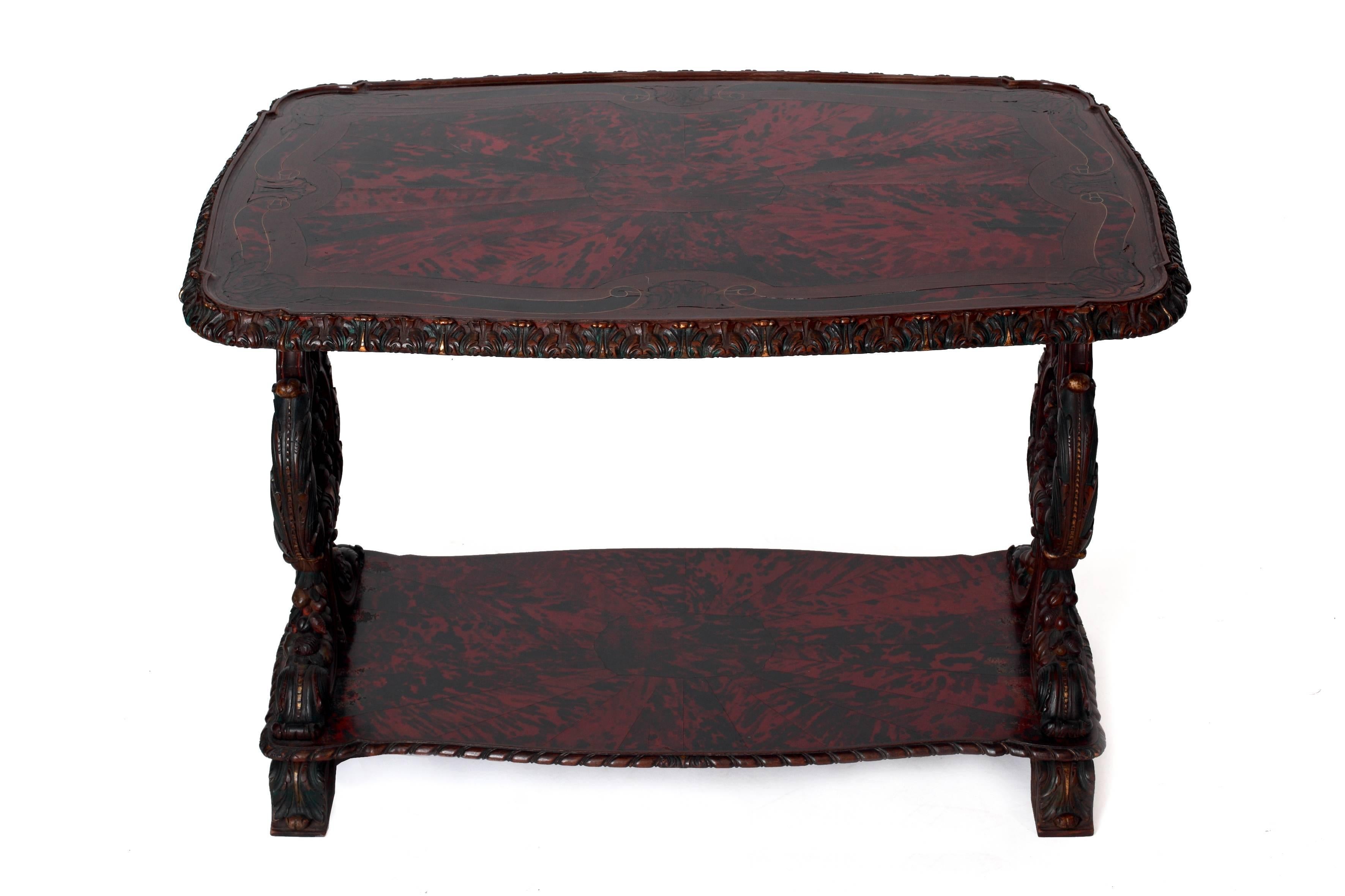 'Maison Franck' coffee table with veneered top in red tortoiseshell and various types of wood supported by two sumptuous carved and lyre-shaped supports joined by a supplementary tray.

Period 1920s-1930s

The top is decorated with geometric and