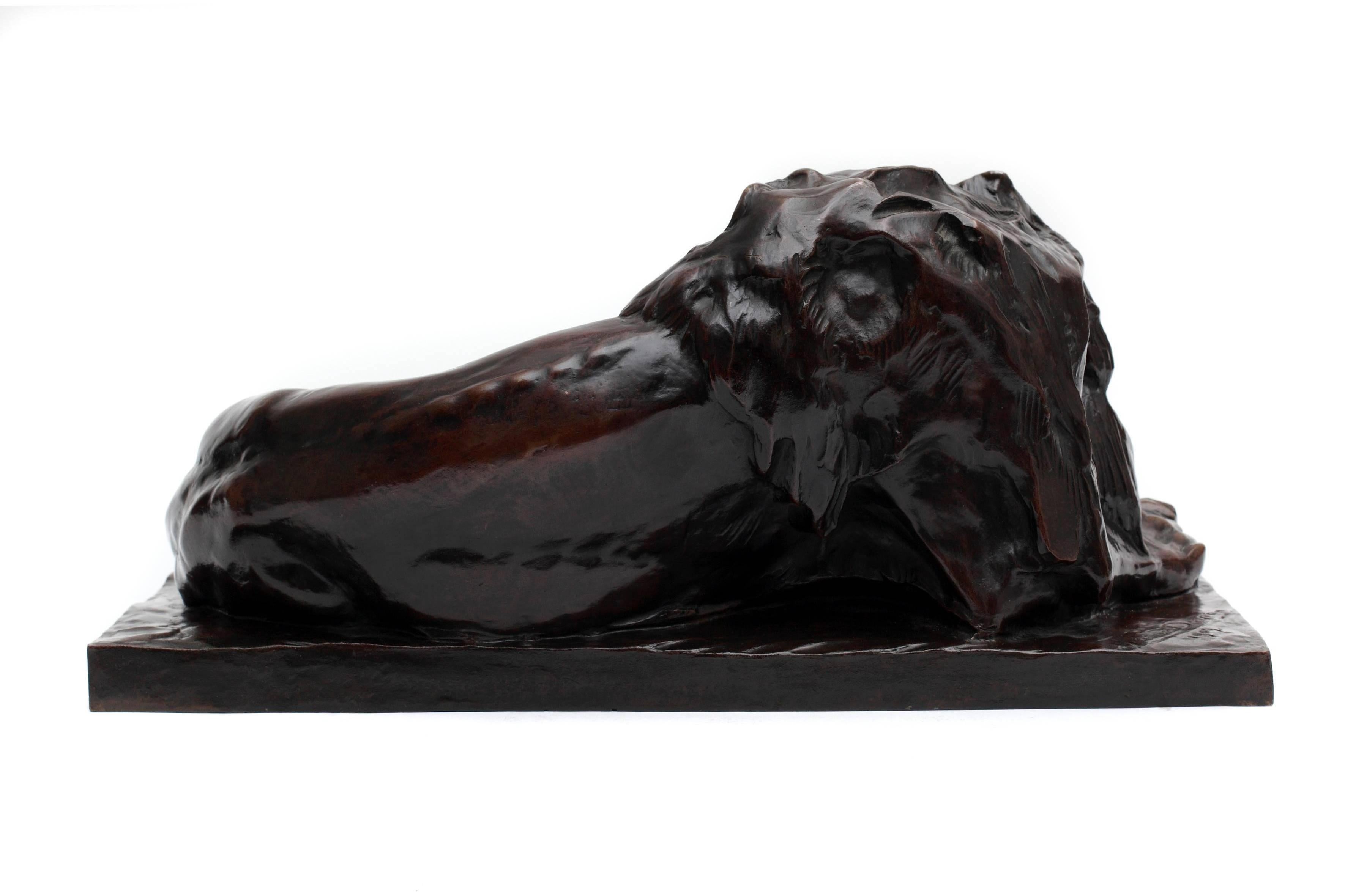 Belgian Reclining Lion Sculpture For Sale