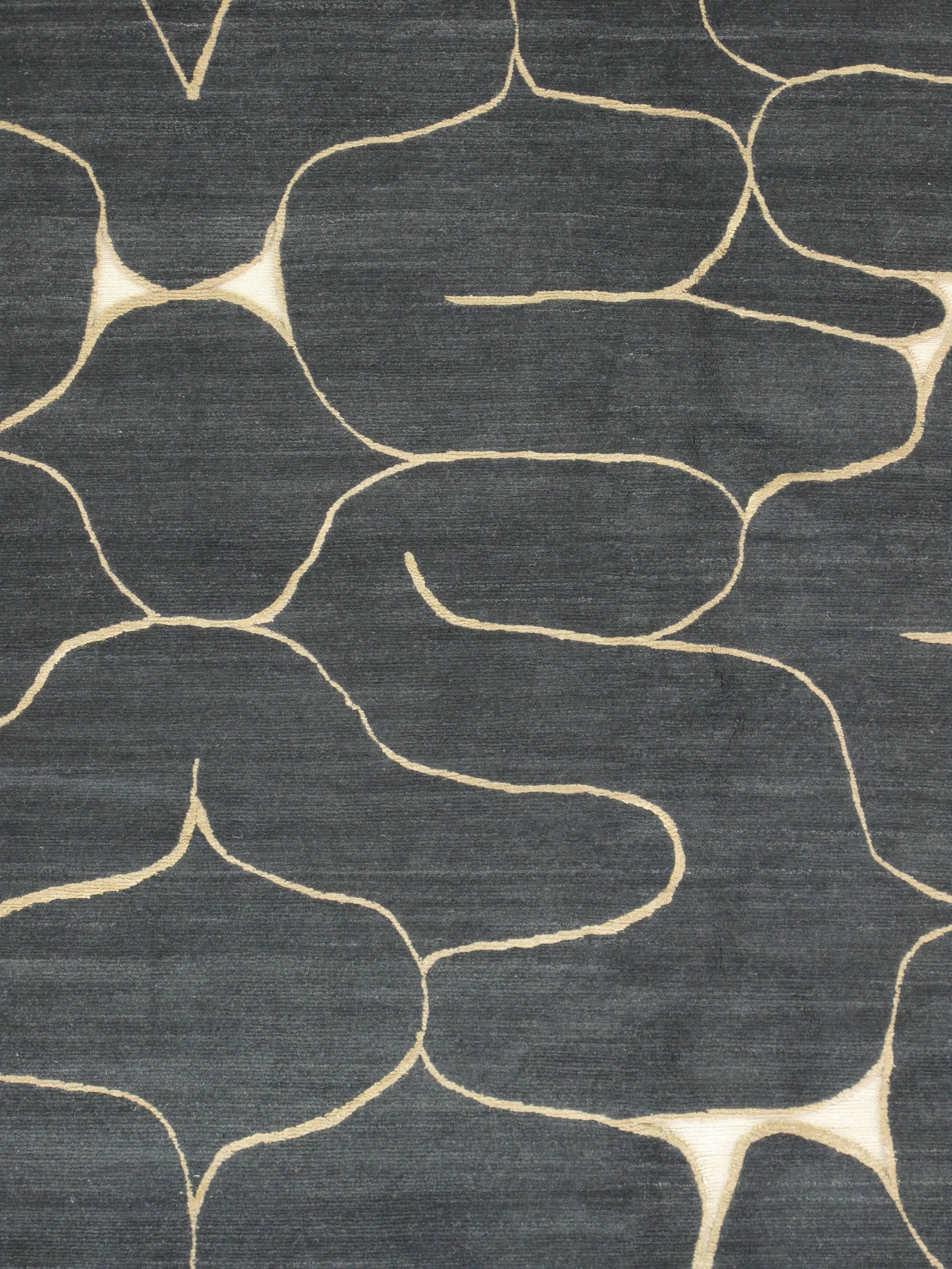 Hand-knotted rug in Himalayan wool with silk accents, GoodWeave certified.