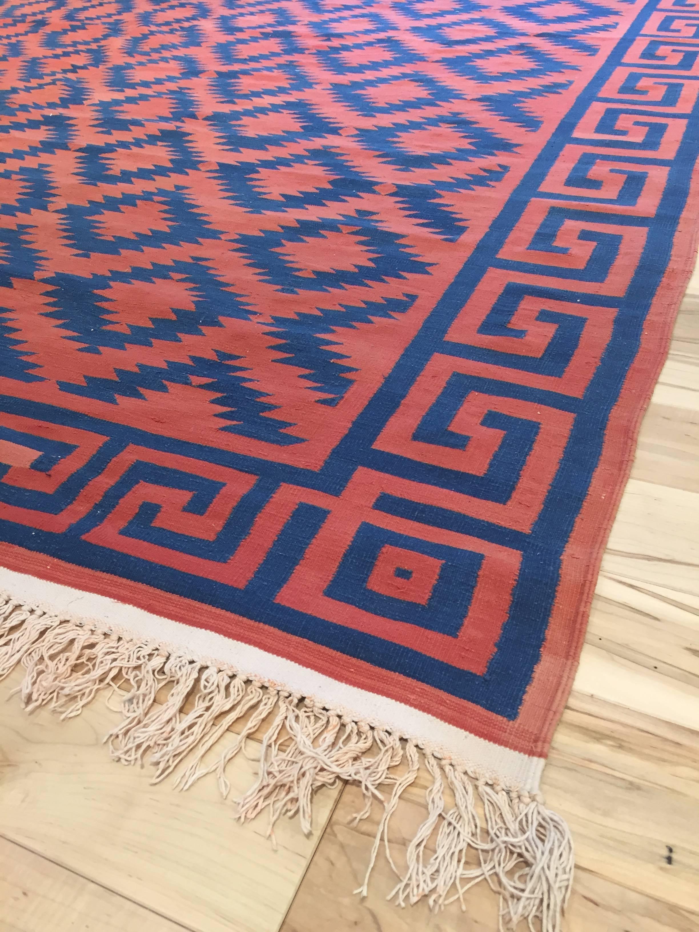 Handwoven Early 20th century Indian Dhurrie, circa 1910, Blue and Red stepped cross with Greek Key border.
