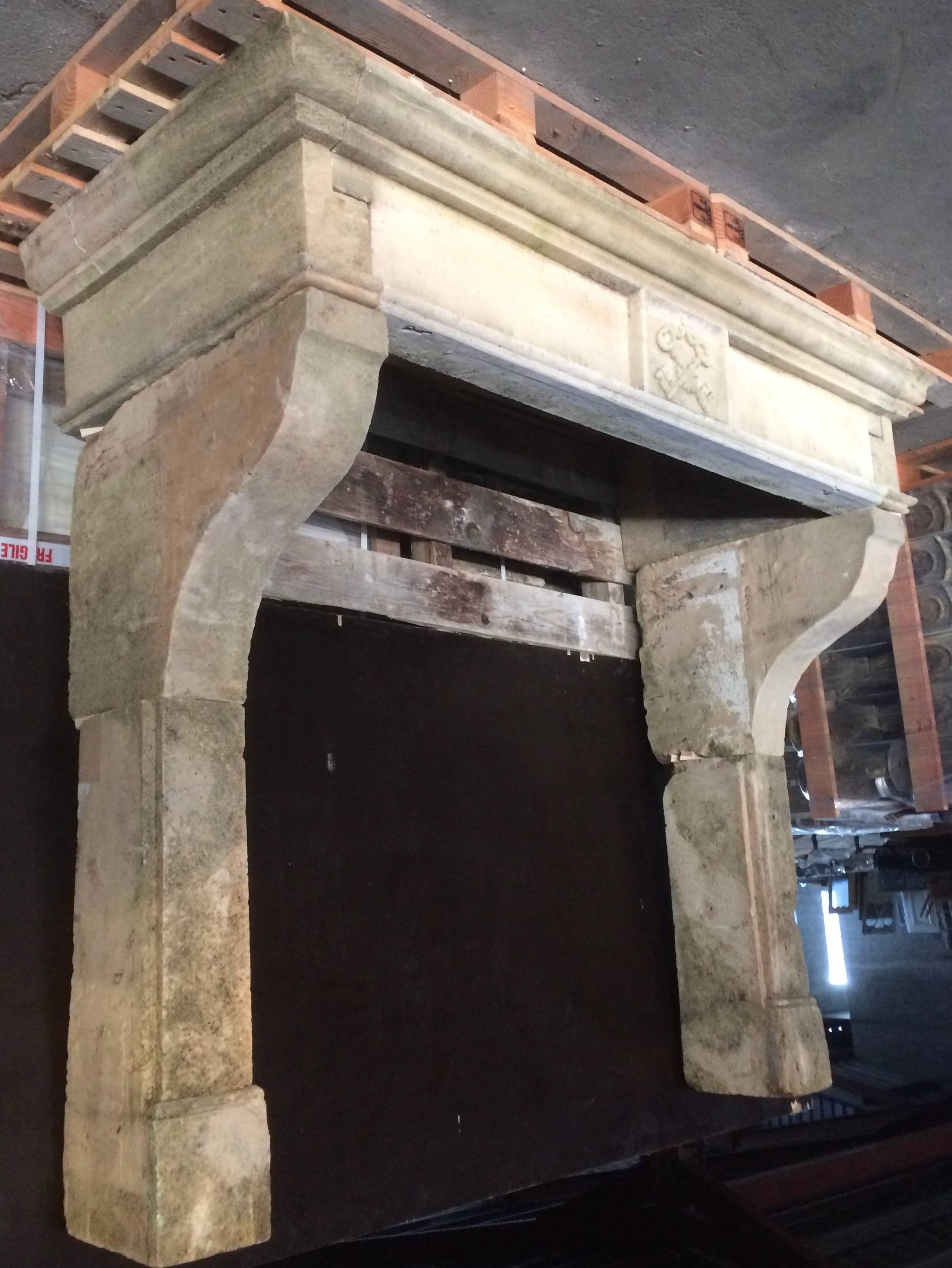 A French Louis XIII style fireplace handcrafted in pure French limestone.
This fireplace was originally hand-carved in the early 18th century, it is all in pure French antique limestone.
It has been restored and cleaned in the 20th century.
It is