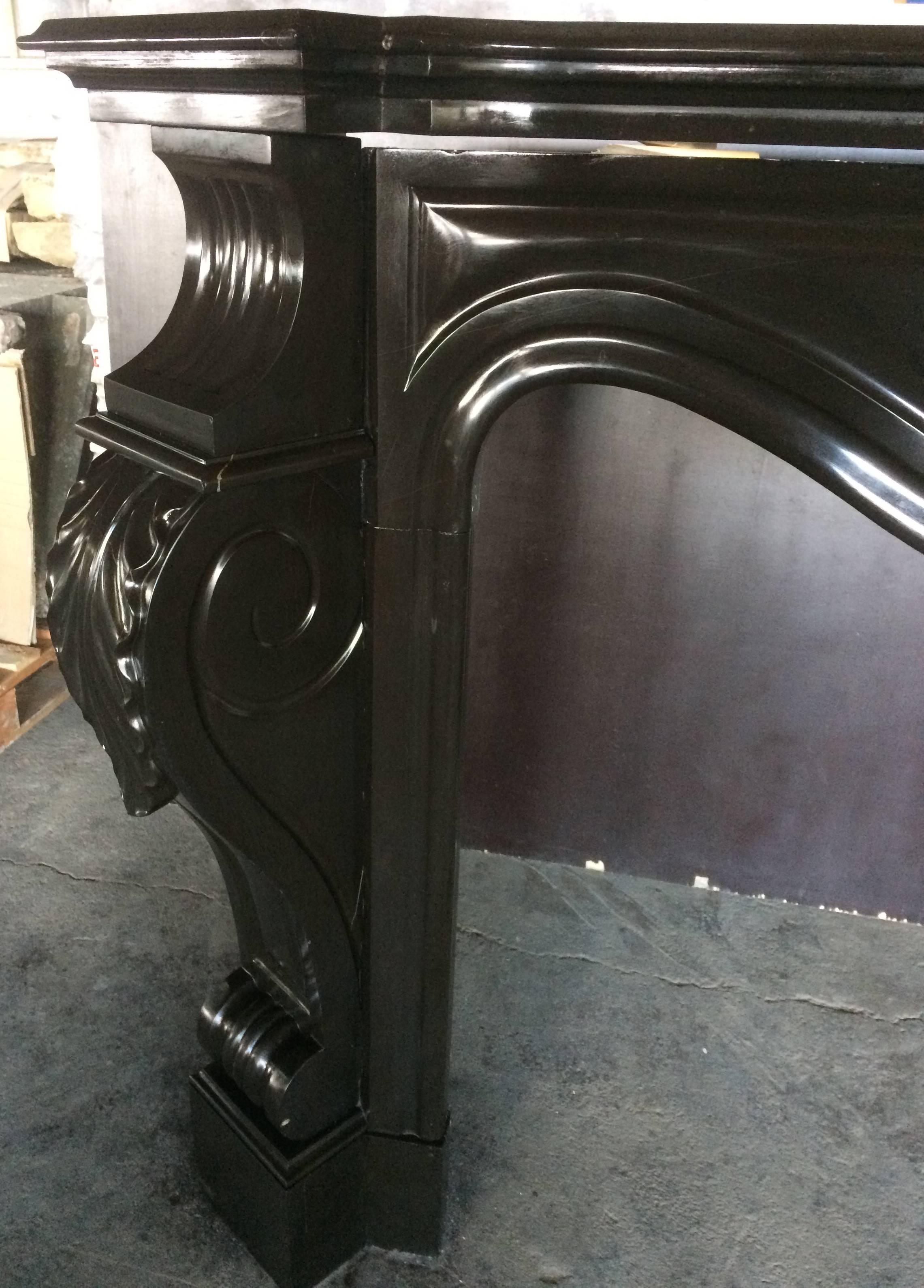 Belgian Black Marble French Antique Louis XV-Regency Style Fireplace, circa 1850s from France For Sale