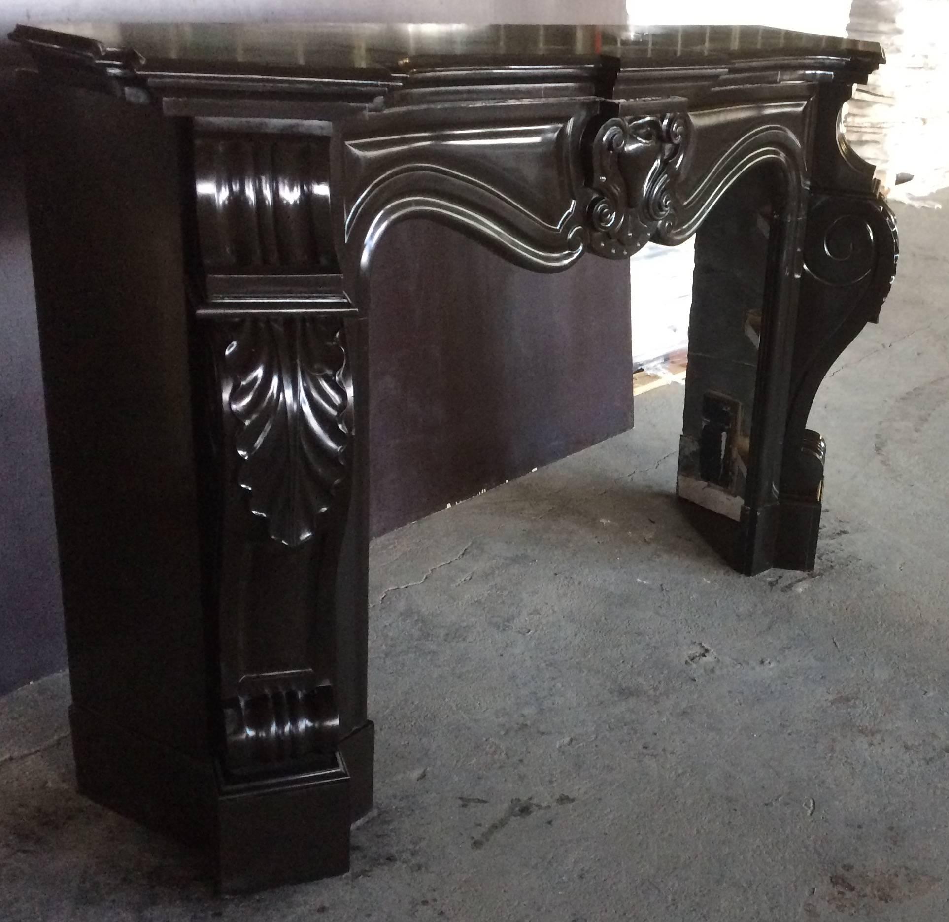 Original French antique Louis XV-Regency style in Belgium black marble, hand-carved, circa 1850s from France.
Excellent quality of Art-work from that period, great quality of hand-carving, shell on middle of mantel, excellent quality of Art work on