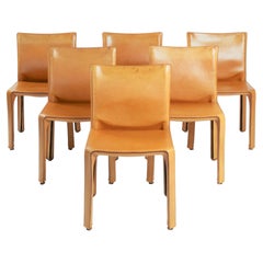 6 sedie da pranzo modello 412 “Cab” in pelle color cognac, disegnate da Mario Bellini per Cassina