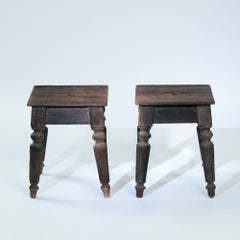 2 handmade rustic pinewood farmer stools with central carrying slot, 19th C