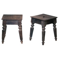 2 handmade rustic pinewood farmer stools with central carrying slot, 19th C