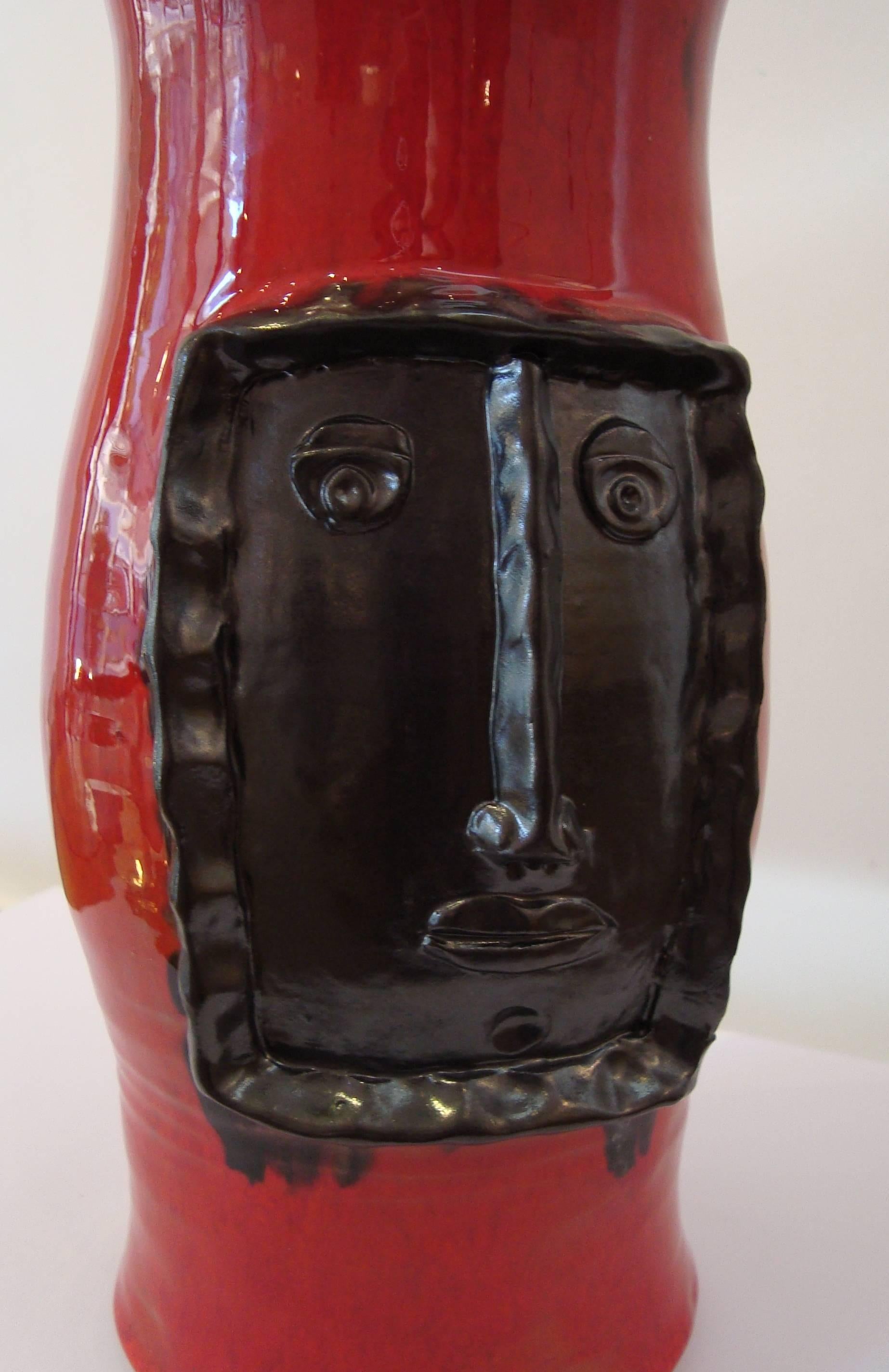Enameled Red Vase with Black Relied Head, by Cloutier Brothers