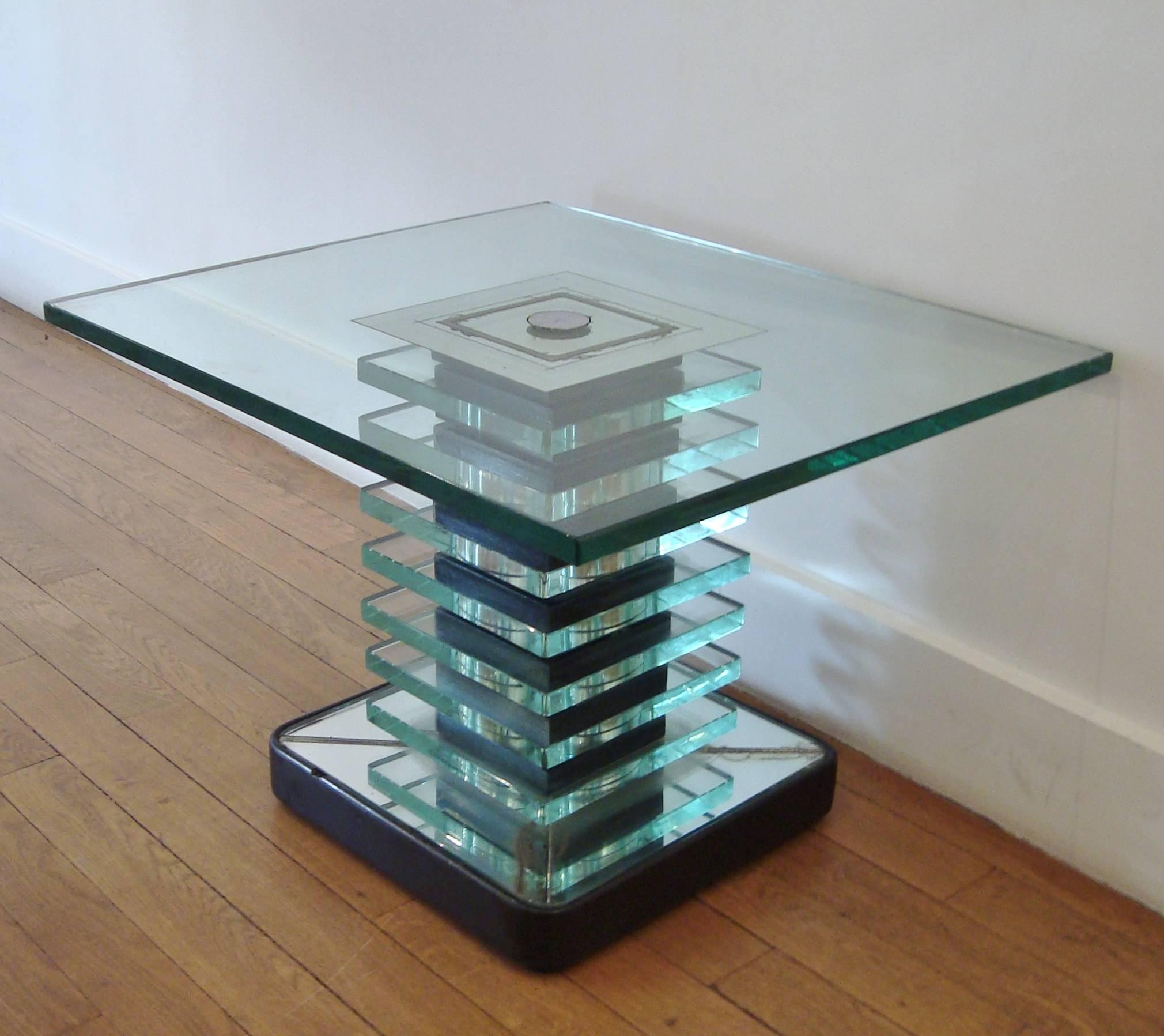 Beautiful modernist glass, mirror and wood gueridon table, Fontana Arte, Italy, 1930-40.  Probably by Pietro CHIESA.
Seven thick glass and eight blackened wood squares, rectangular top with mirrored center. Mirror, steel and wood base. 
Shaft width