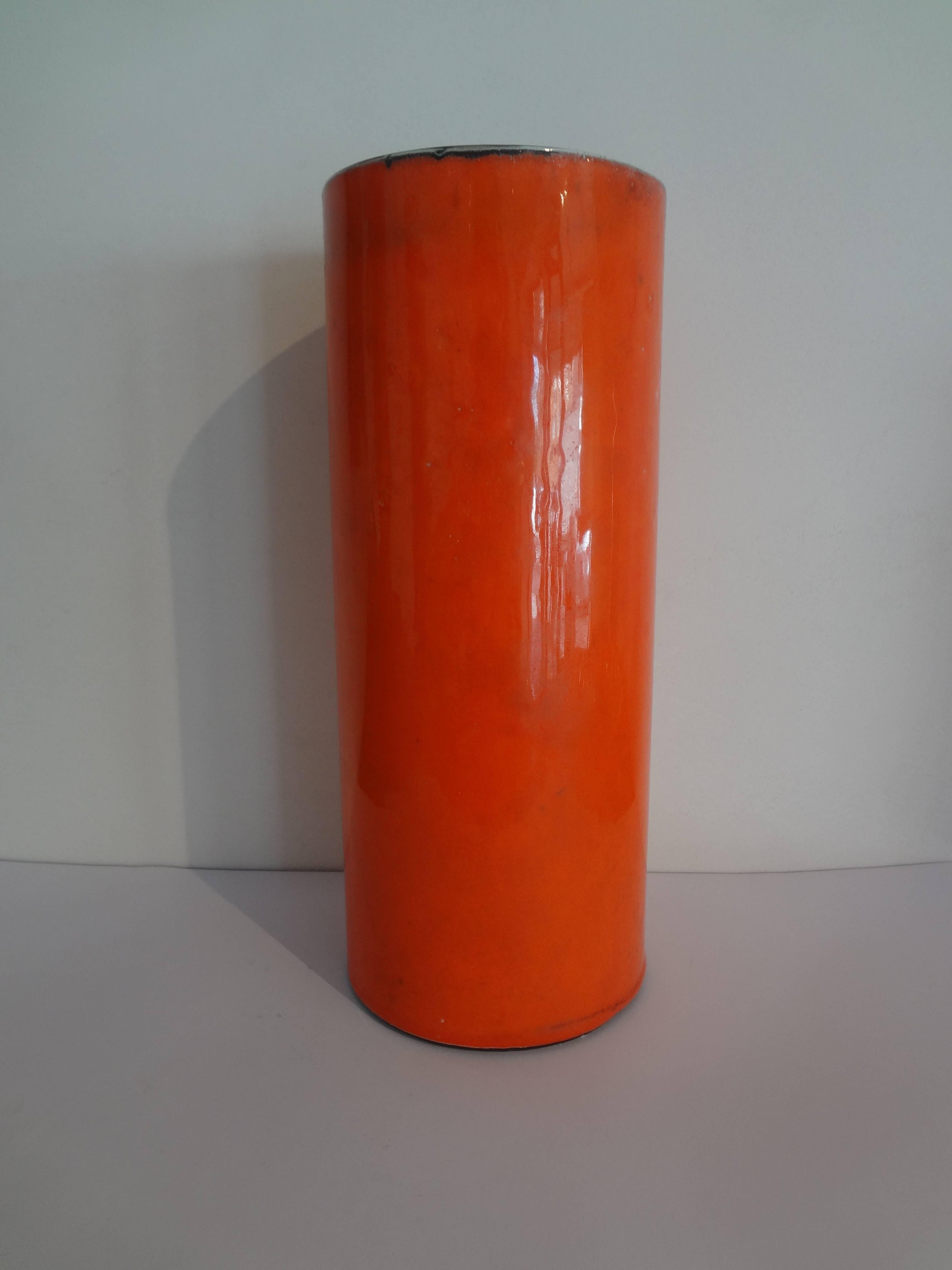 High orange cylinder vase.
Georges Jouve, circa 1956.
Shiny enamelled cover with a mate black inside.
Signed Jouve and Alpha.

Ref : Michel Fare, Georges Jouve Ceramiste, 1965, Modèle p.71g, p.88.
     